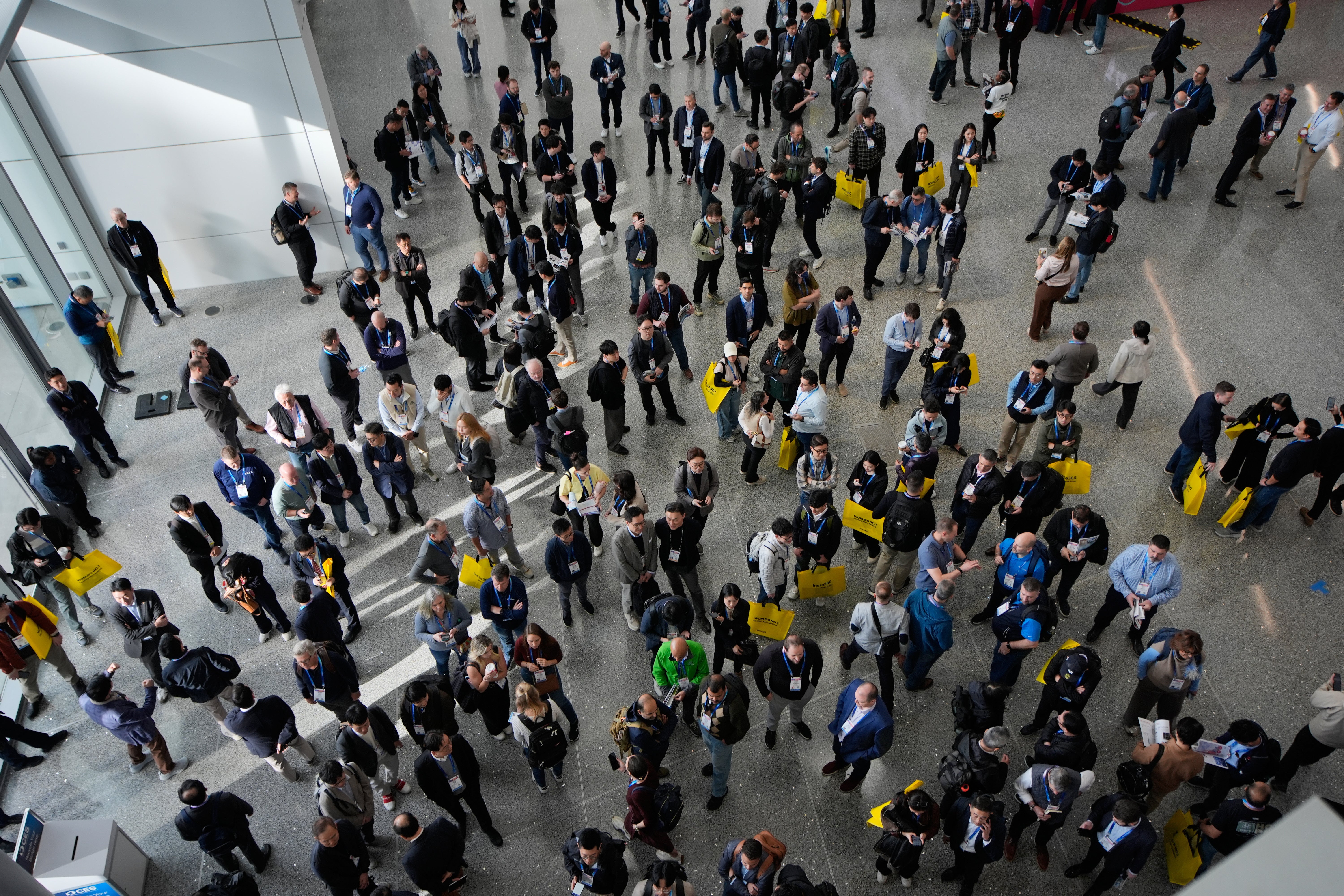 People wait to enter the CES 2026 show in Las Vegas