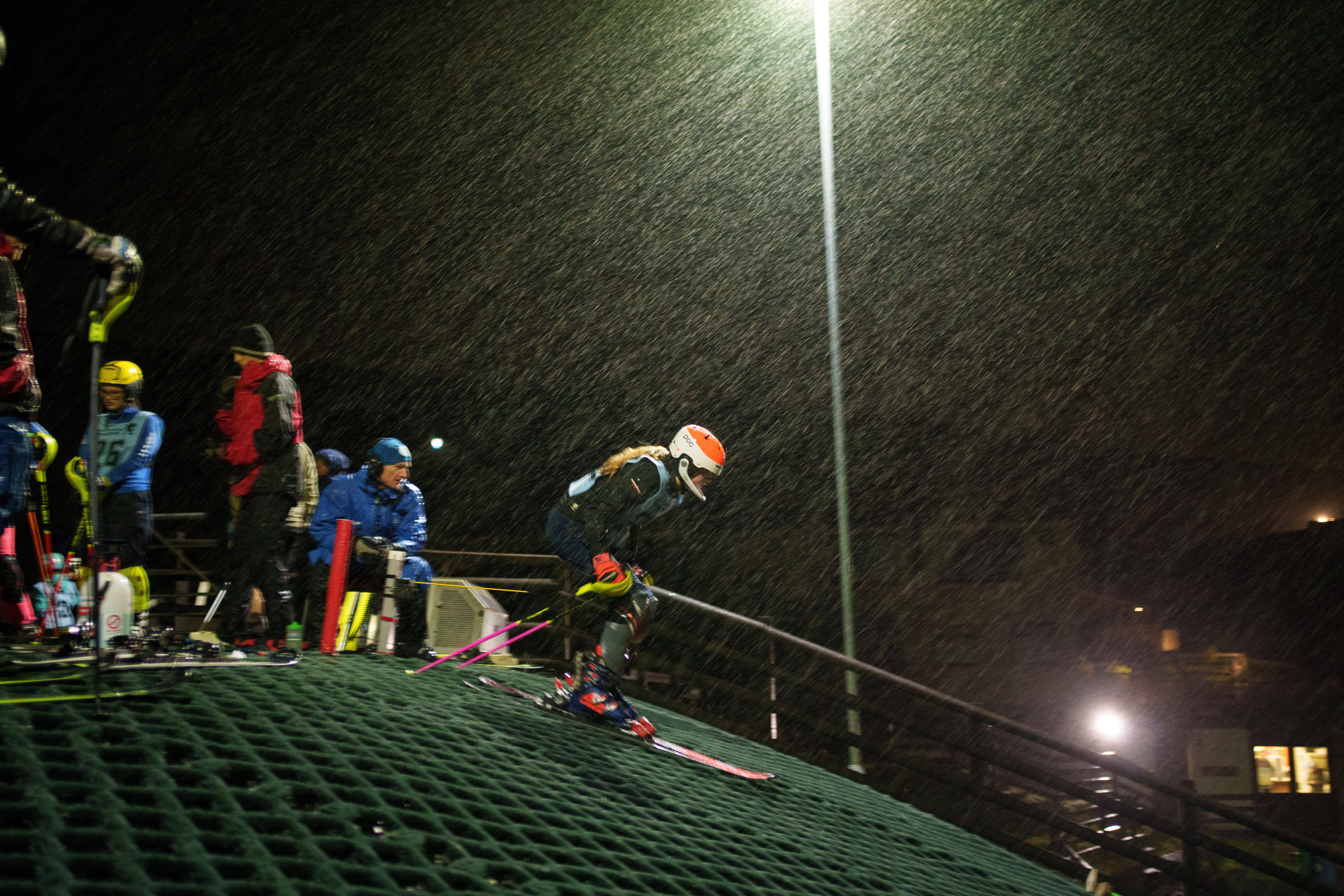 Heavy rain falls as a skier competes in a slalom race during an inter-club ski meeting at Pendle Ski Club