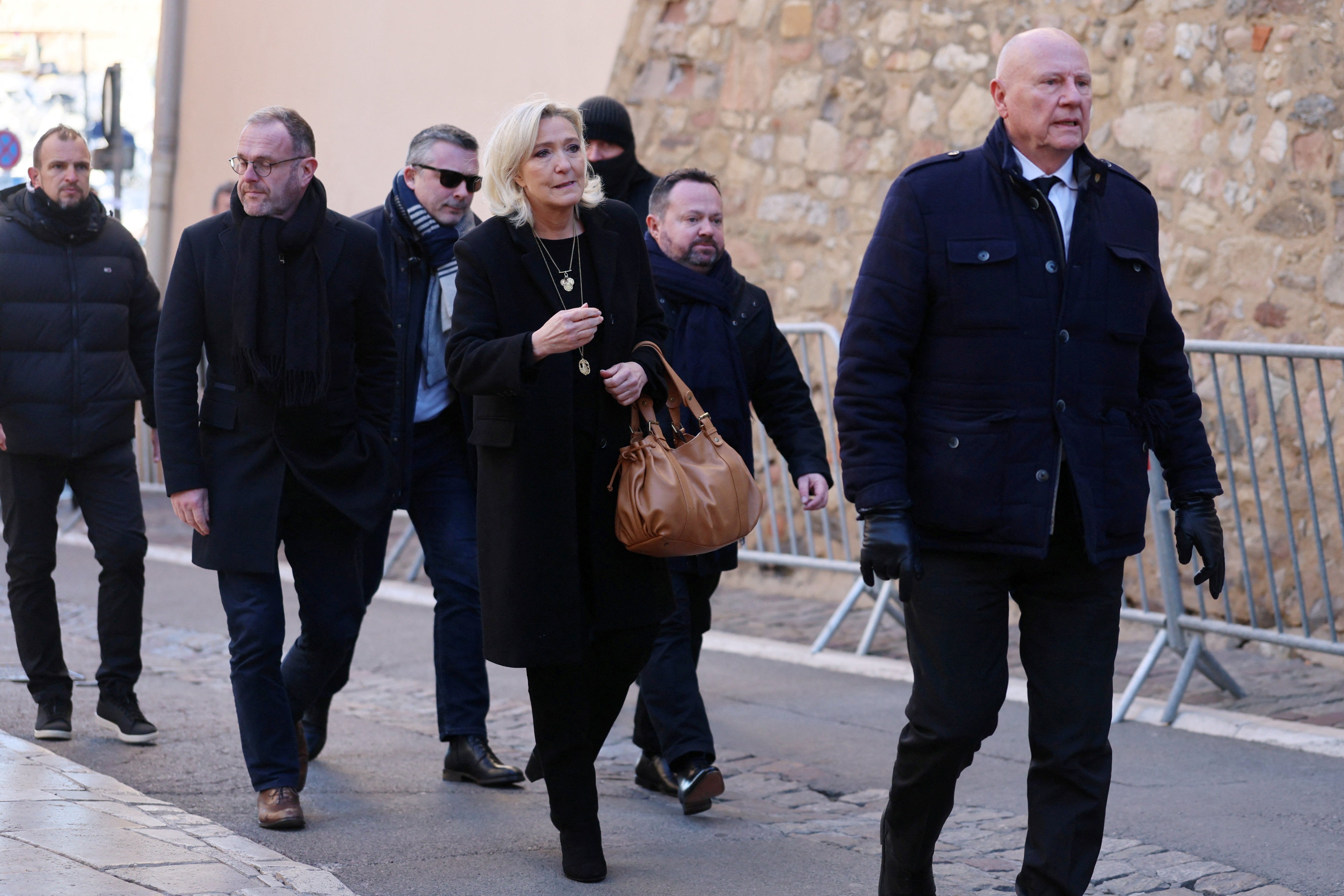 French far-right leader and member of parliament Marine Le Pen, President of the French far-right National Rally (Rassemblement National - RN) party parliamentary group, Steve Briois and Burno Bilde arrive to attend the funeral service for the late French film icon Brigitte Bardot