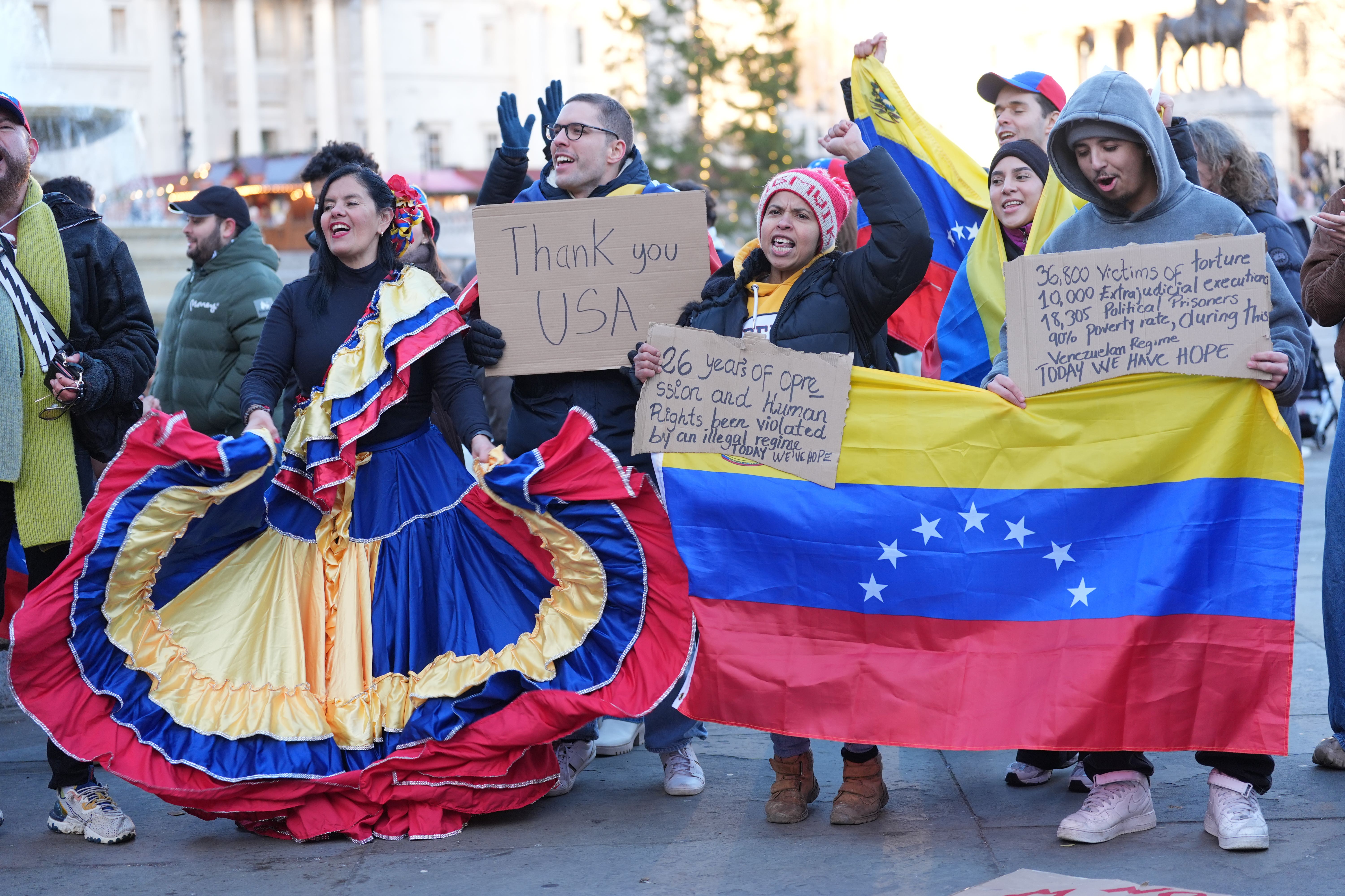 Members of the Venezuelan community in the UK, celebrate in Trafalgar Square in London (Yui Mok/PA)