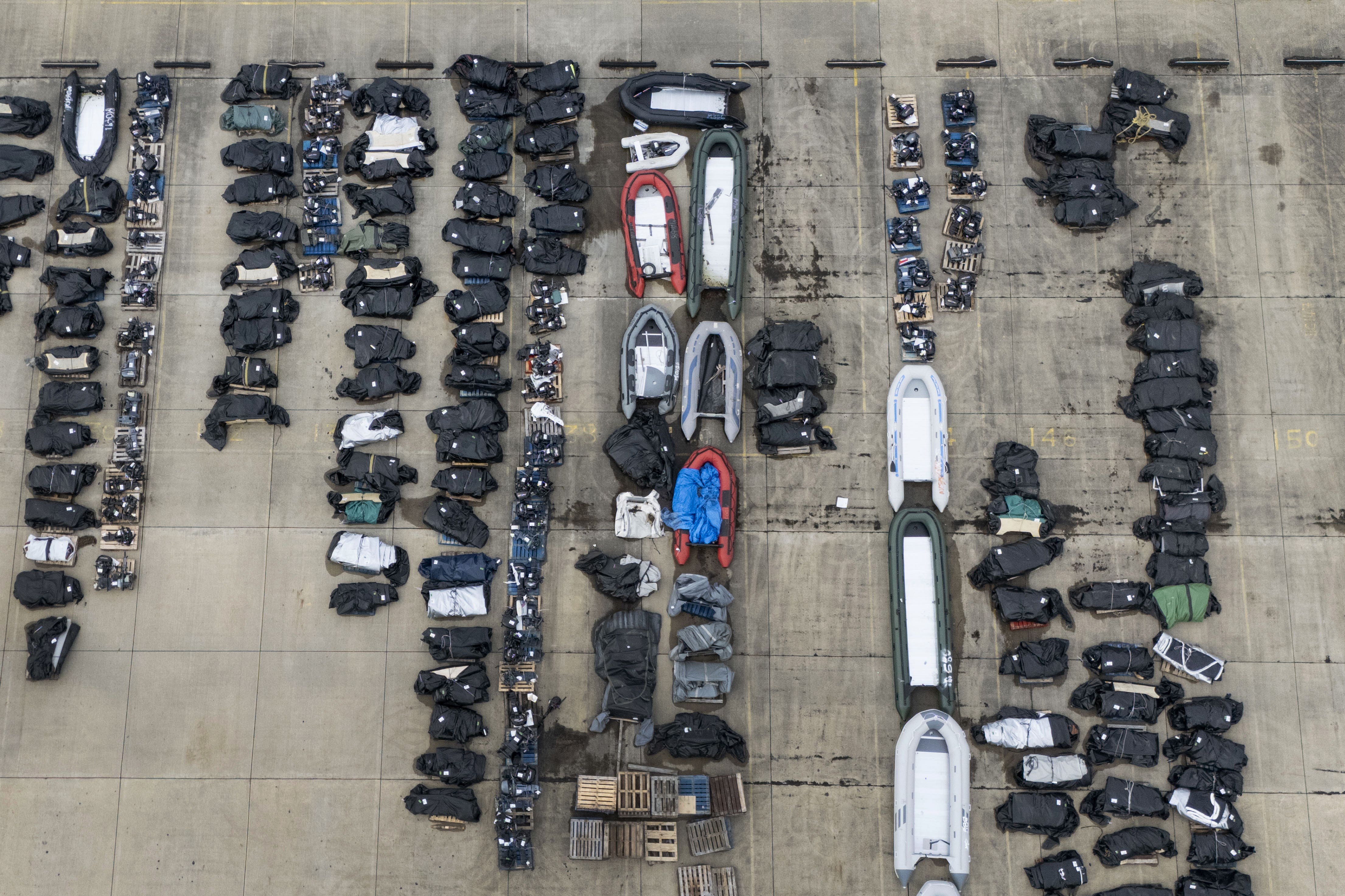 A view of small boats and outboard motors used by people thought to be migrants to cross the Channel (PA)