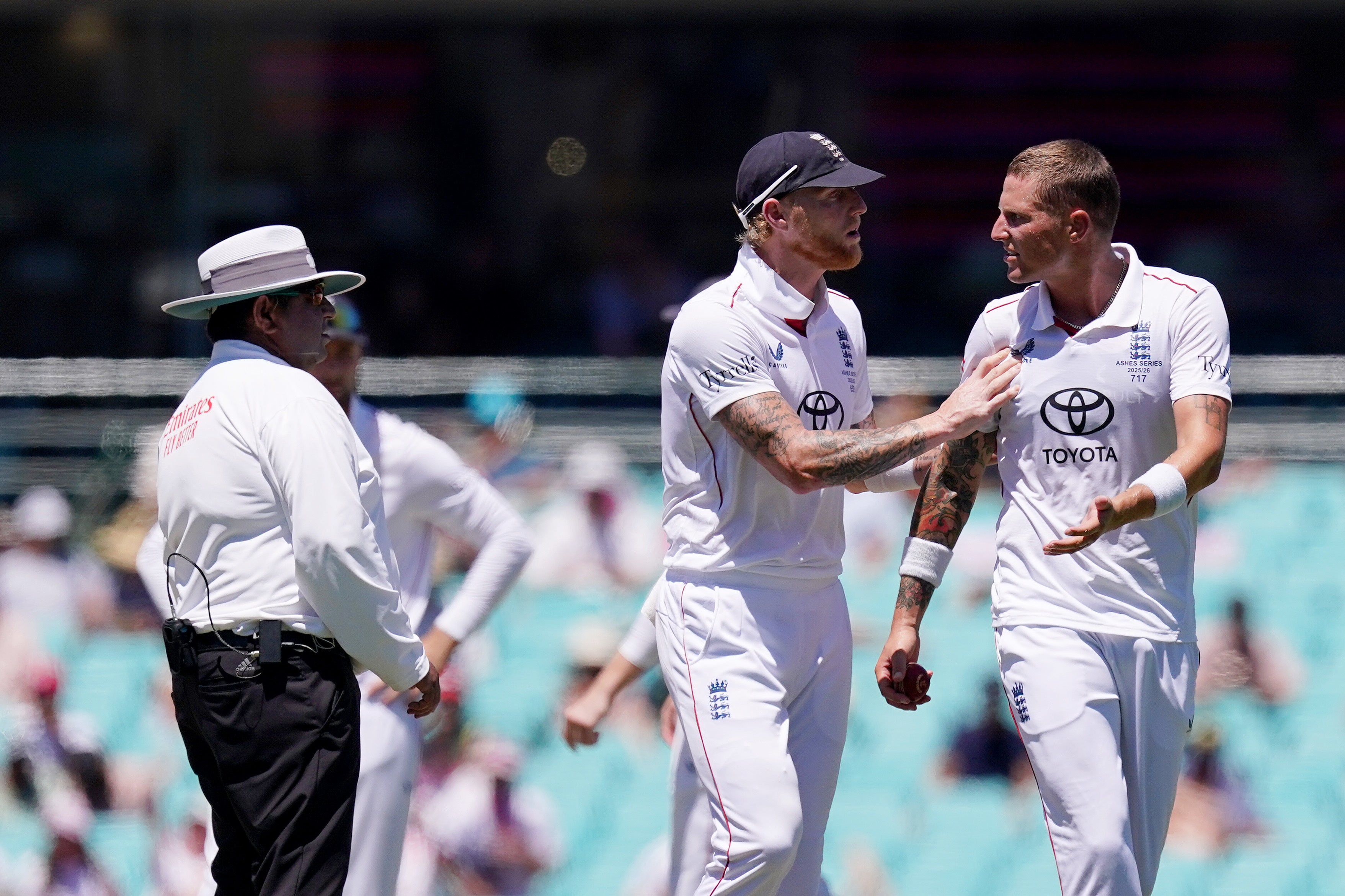 England’s Ben Stokes has to push Brydon Carse away from the umpire after an unsuccessful review on the final day of the Sydney Test