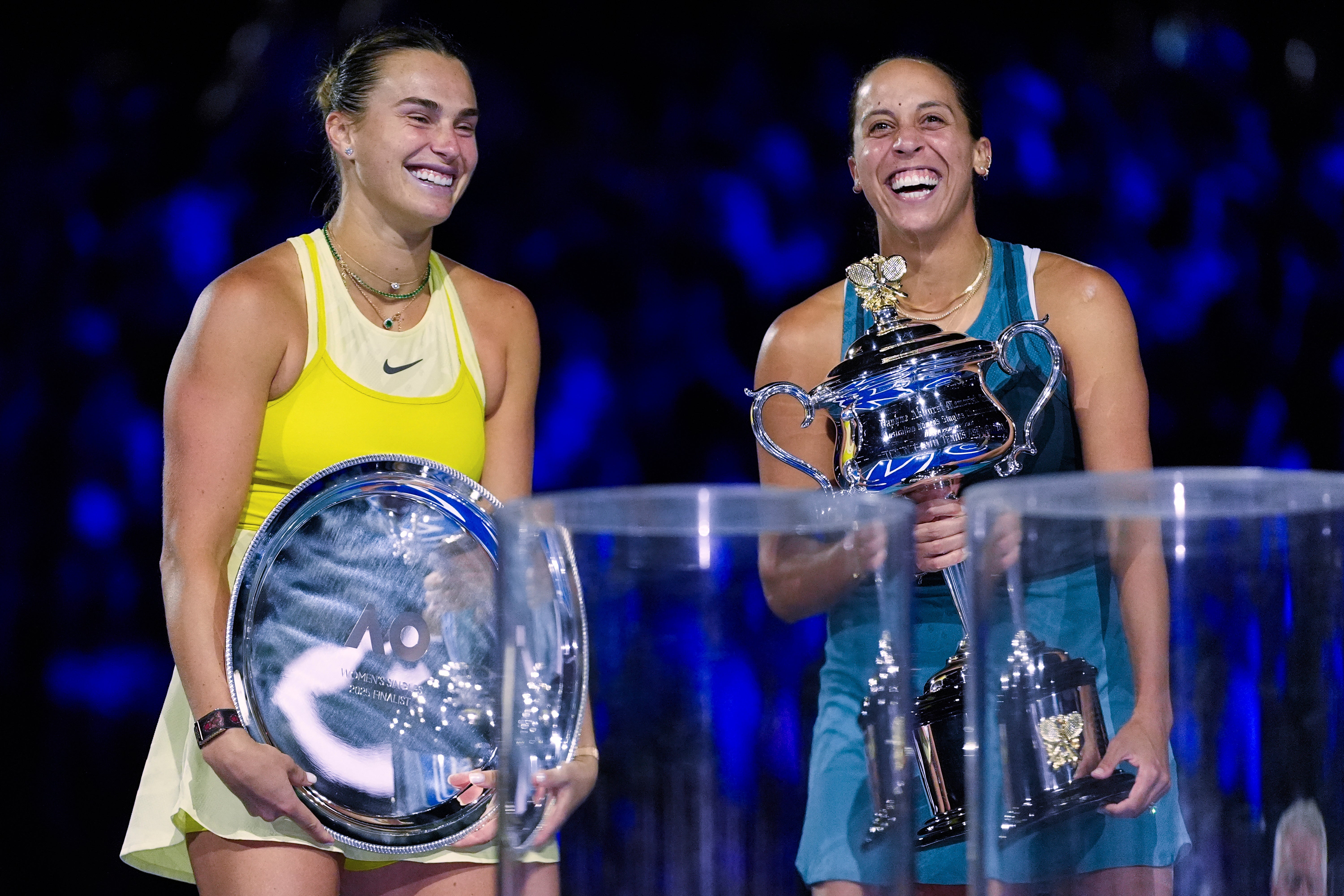 Madison Keys, right, holds the Daphne Akhurst Memorial Cup after defeating Aryna Sabalenka, left, in the women's singles final at the 2025 Australian Open
