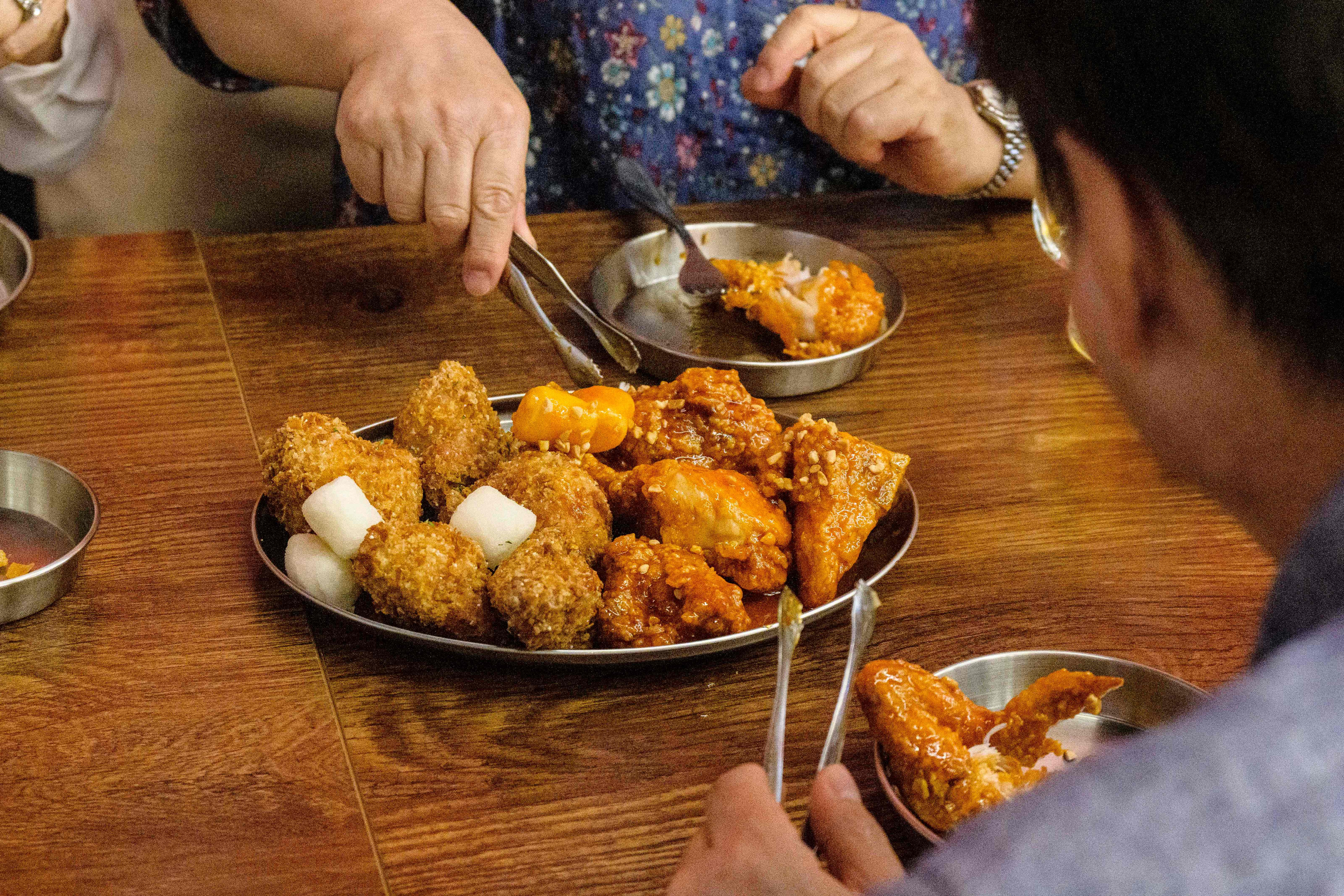 Yangnyeom chicken is fried chicken coated in a sweet, spicy red sauce made with chilli powder and starch syrup