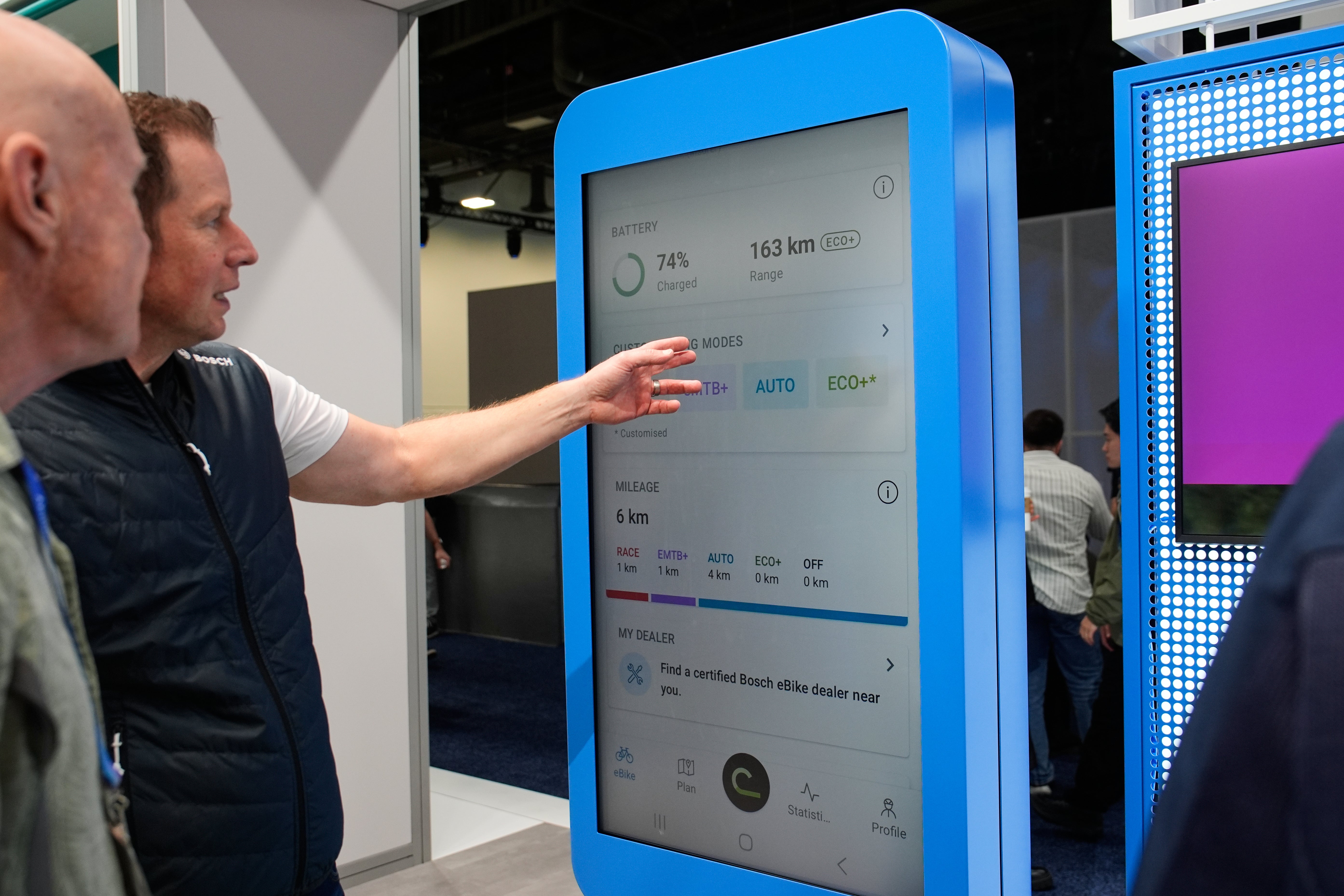 People look at a display of the Bosch eBike Flow app at the Bosch booth during the CES tech show Wednesday, Jan. 7, 2026, in Las Vegas