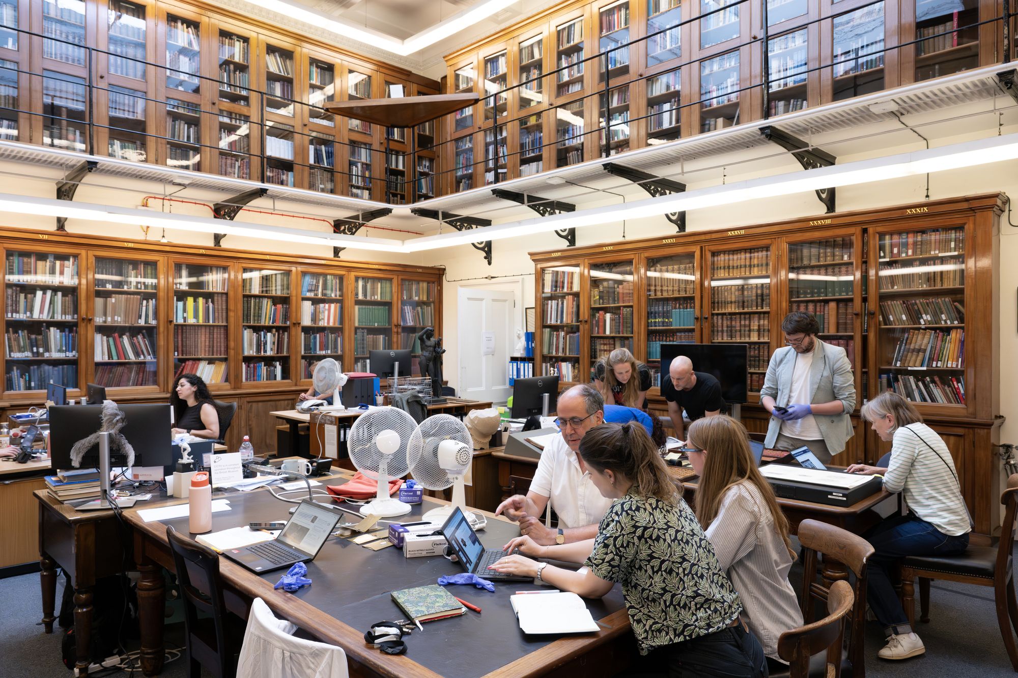 Professor Tom Harrison (centre front) working with his team inside the British Museum on tracing missing items