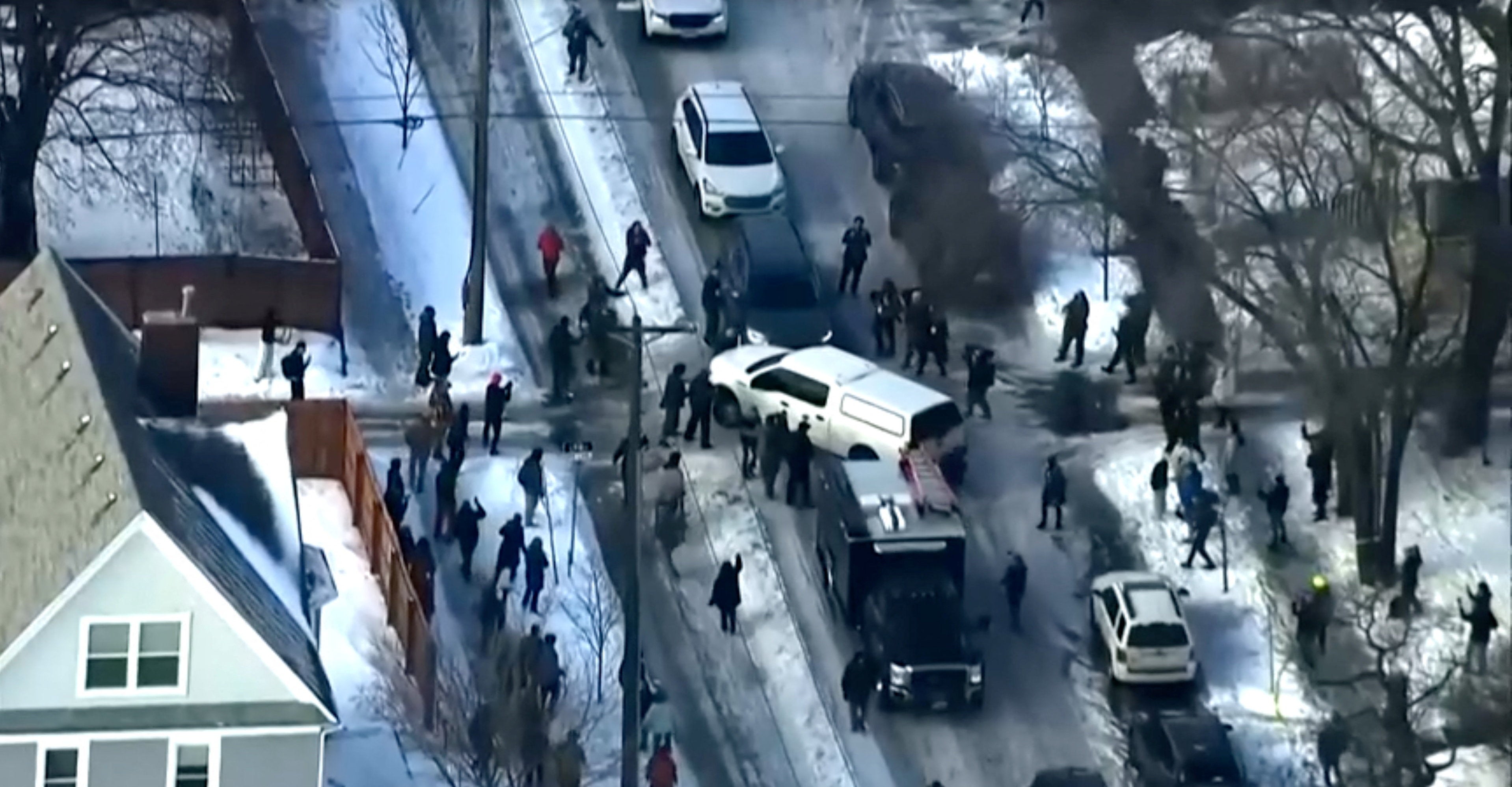 An aerial view shows protesters clashing with police after a driver of a vehicle was shot amid an immigration enforcement surge, in Minneapolis, Minnesota, U.S., January 7
