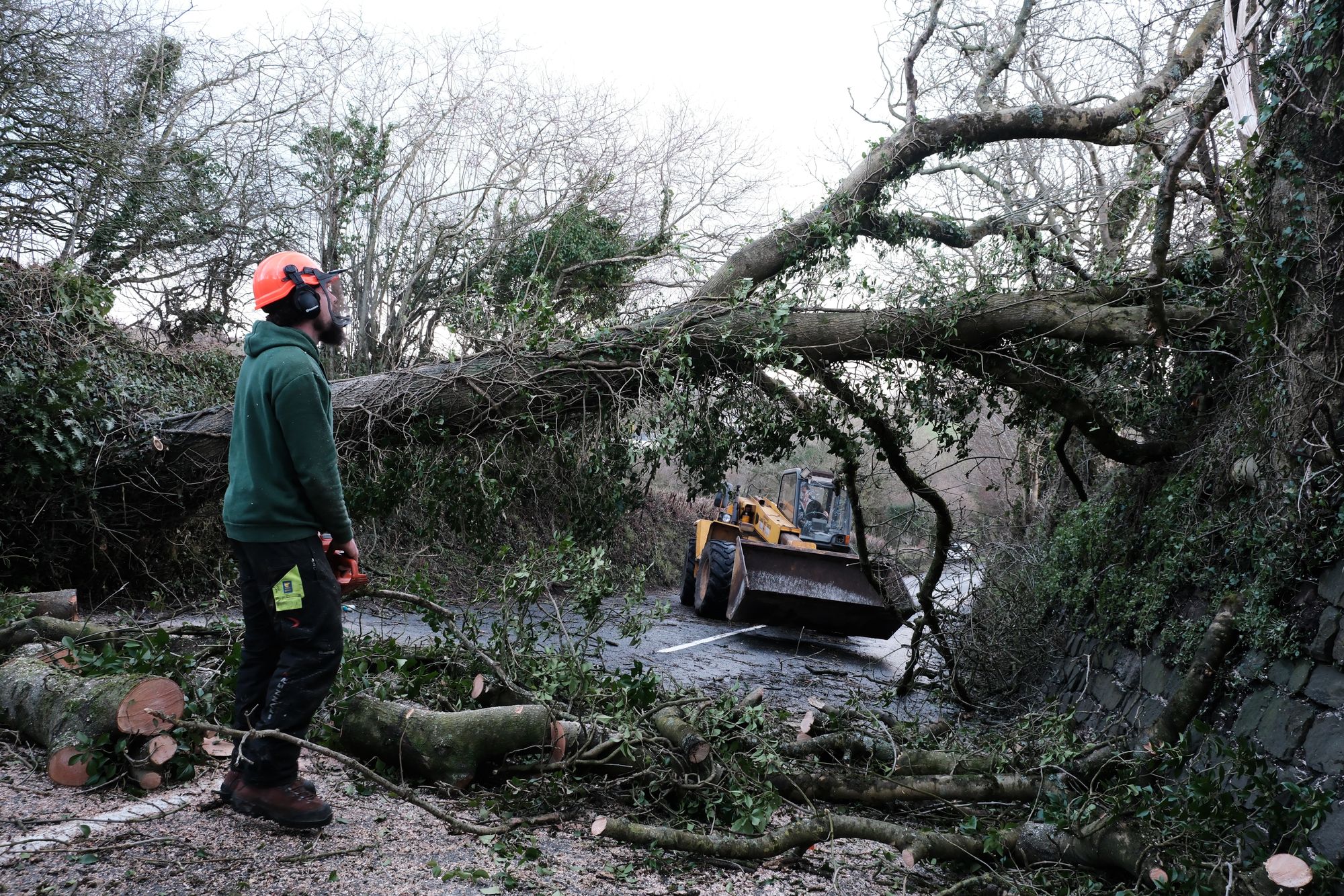 A fallen tree is cleared from a road in St Stephen, Cornwall. Storm Goretti continues to batter the UK with tens of thousands of Britons across the country facing widespread power cuts, travel disruption and school closures. Picture date: Friday January 9, 2026. PA Photo. Photo credit should read: Matt Keeble/PA Wire