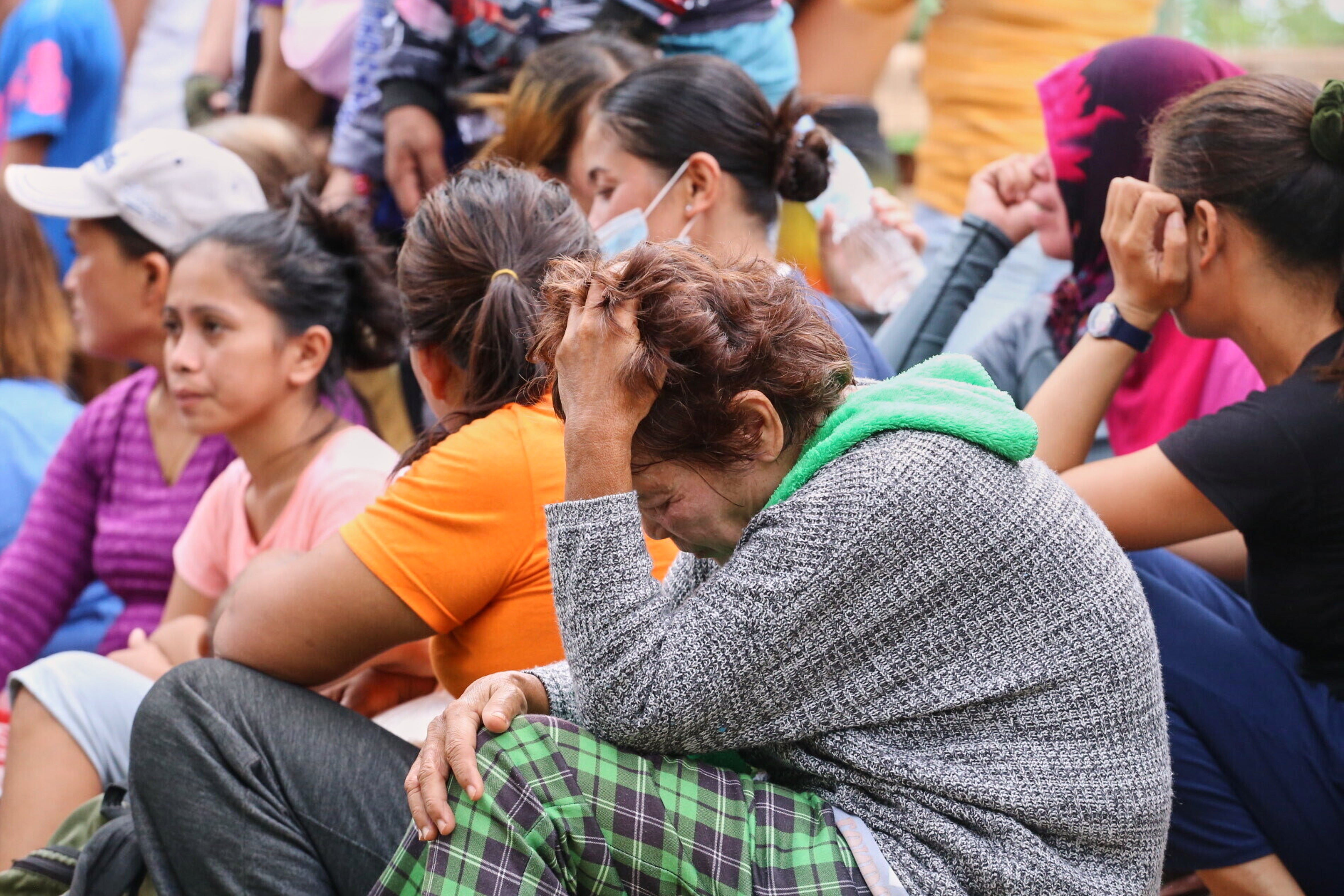 Relatives wait for news after a garbage mound collapsed at a waste segregation facility in Binaliw, Cebu city, on 9 January 2026