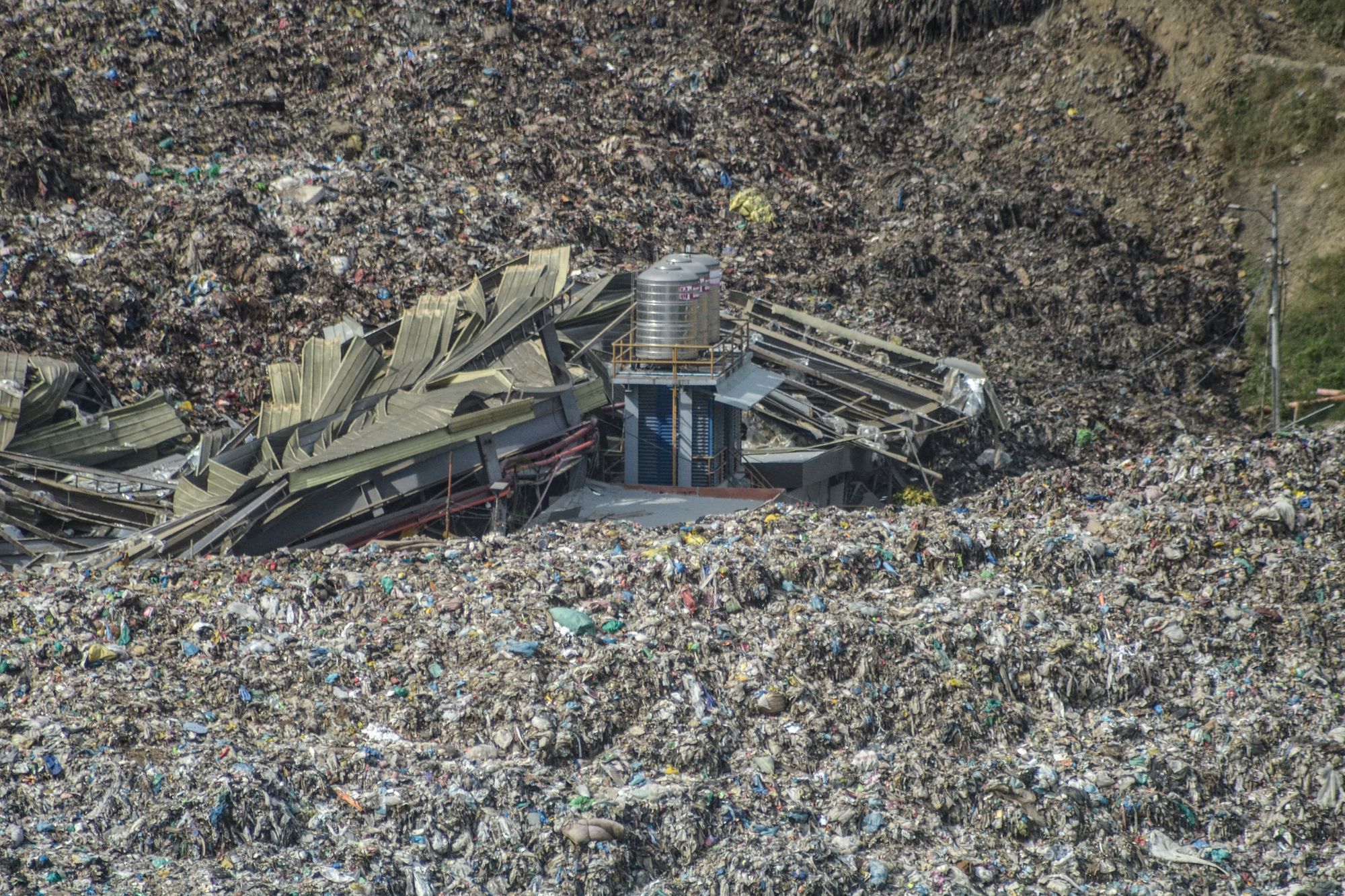 An aerial view shows a landslide at the landfill in Barangay Binaliw, Cebu, on 9 January 2026