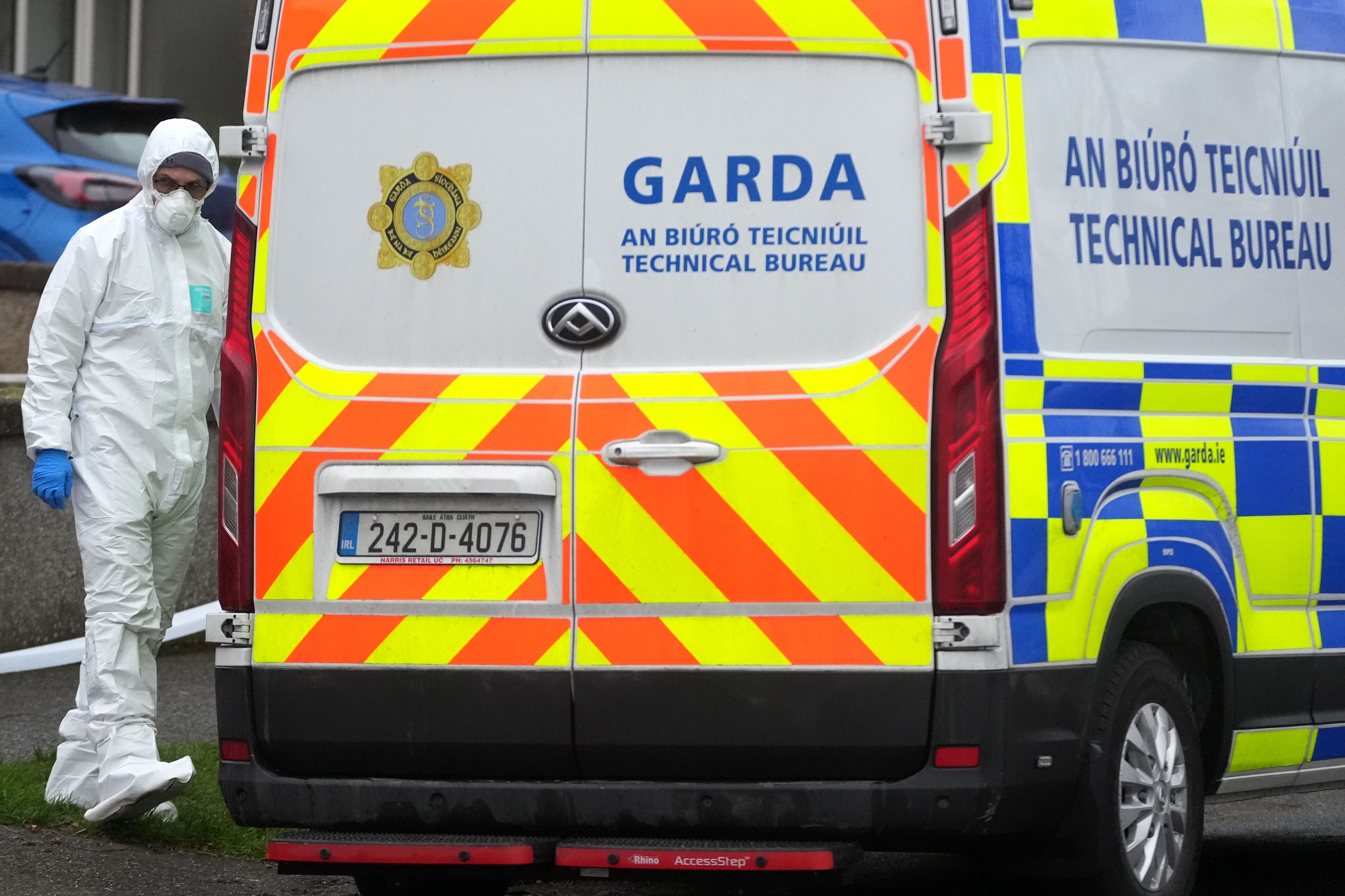 A member of An Garda Technical Bureau outside a property in the Clondalkin area, Dublin (PA)