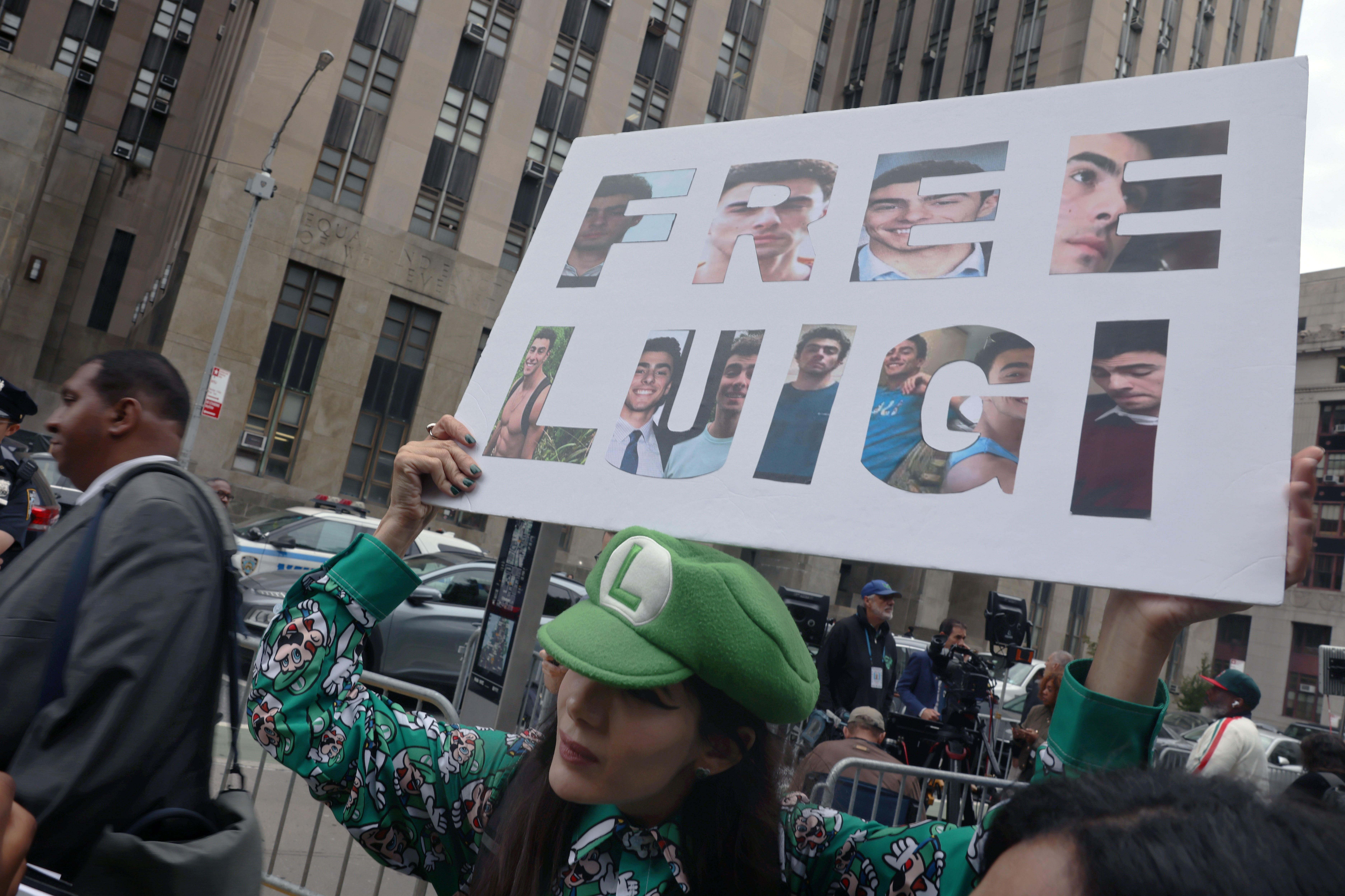 Supporters of Luigi Mangione gather following a hearing where terrorism charges against him were dismissed in the murder of UnitedHealth Care CEO Brian Thompson, outside of Manhattan Supreme Court on September 16, 2025 in New York City