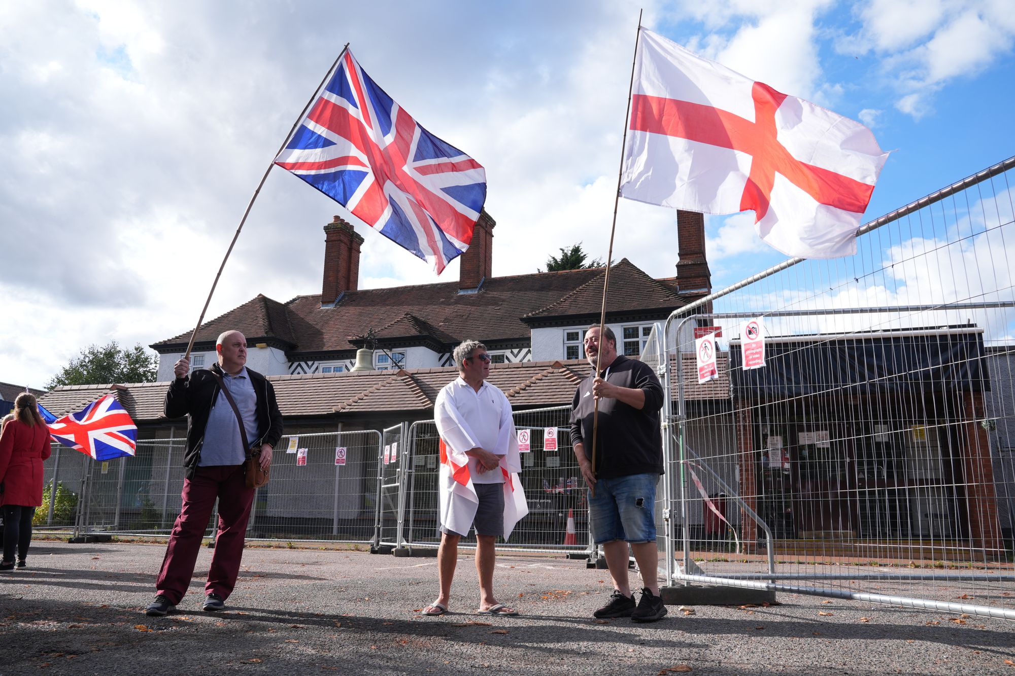 <p>Protesters outside the Bell Hotel in Epping, Essex, which was subject to a court case over its use to house asylum seekers </p>
