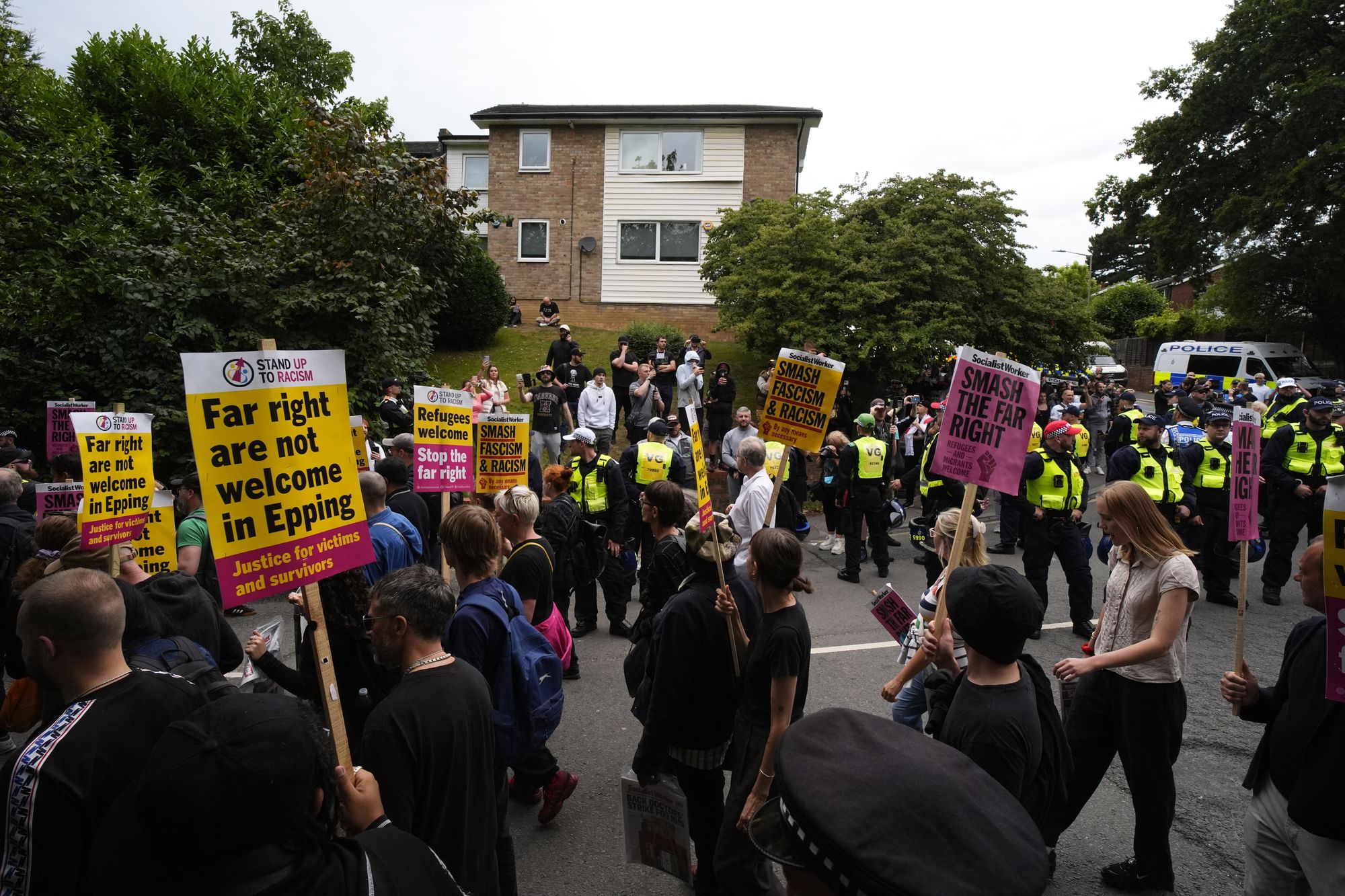People taking part in a Stand Up to Racism protest in Epping, Essex, after counter-protests against an asylum hotel in the area