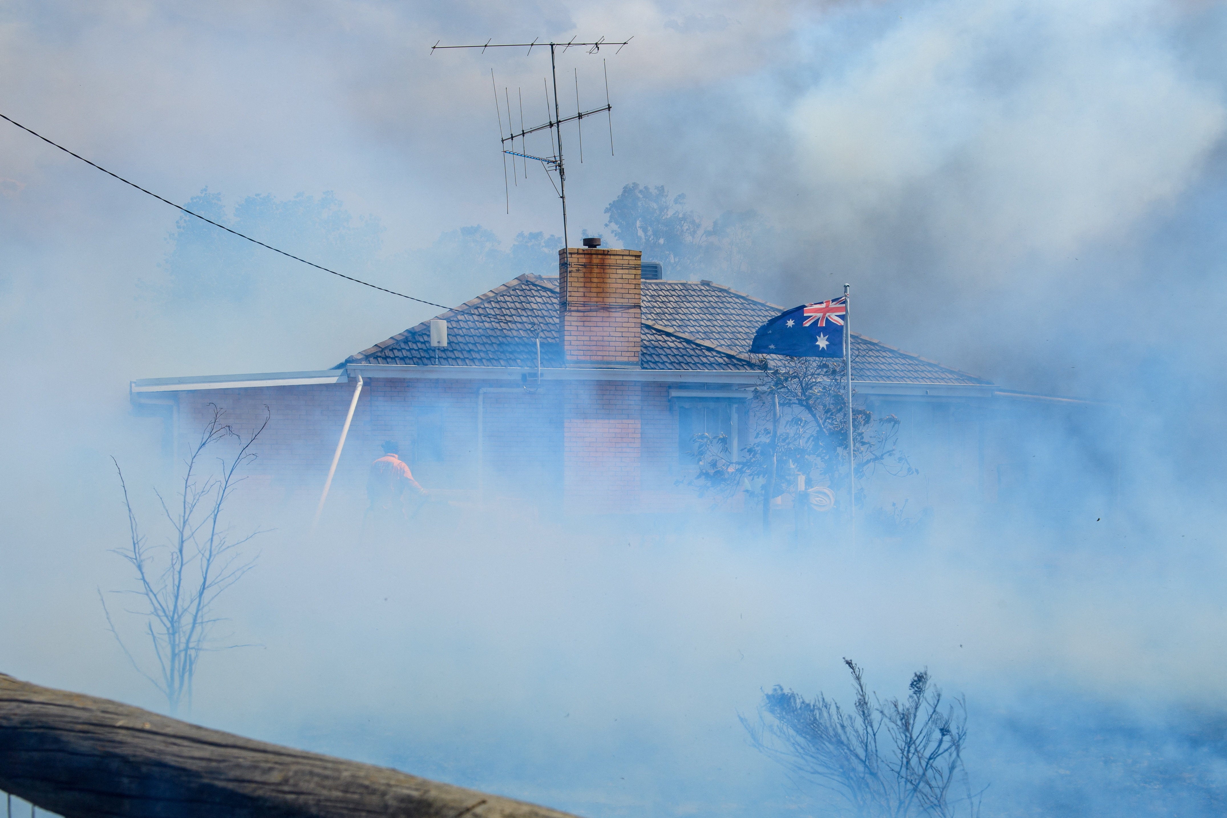Three missing as ‘catastrophic’ bushfires cut power to 90,000 Australian homes in 46C heat