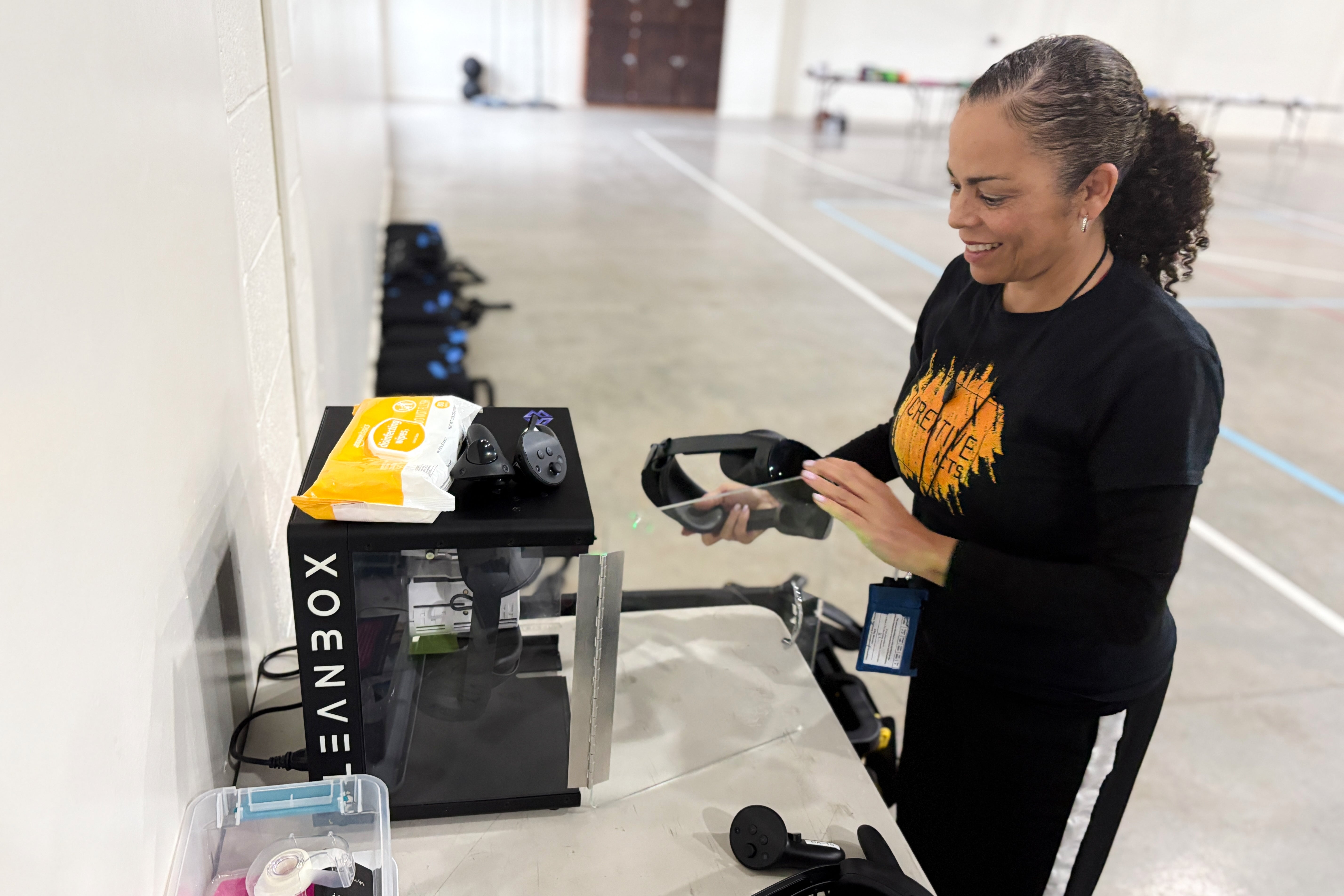 Sabra Williams, Co-Founder of Creative Acts, cleans virtual reality headsets inside Valley State Prison in Chowchilla, Calif., Dec. 11, 2025. (AP Photo/Haven Daley) Virtual Reality