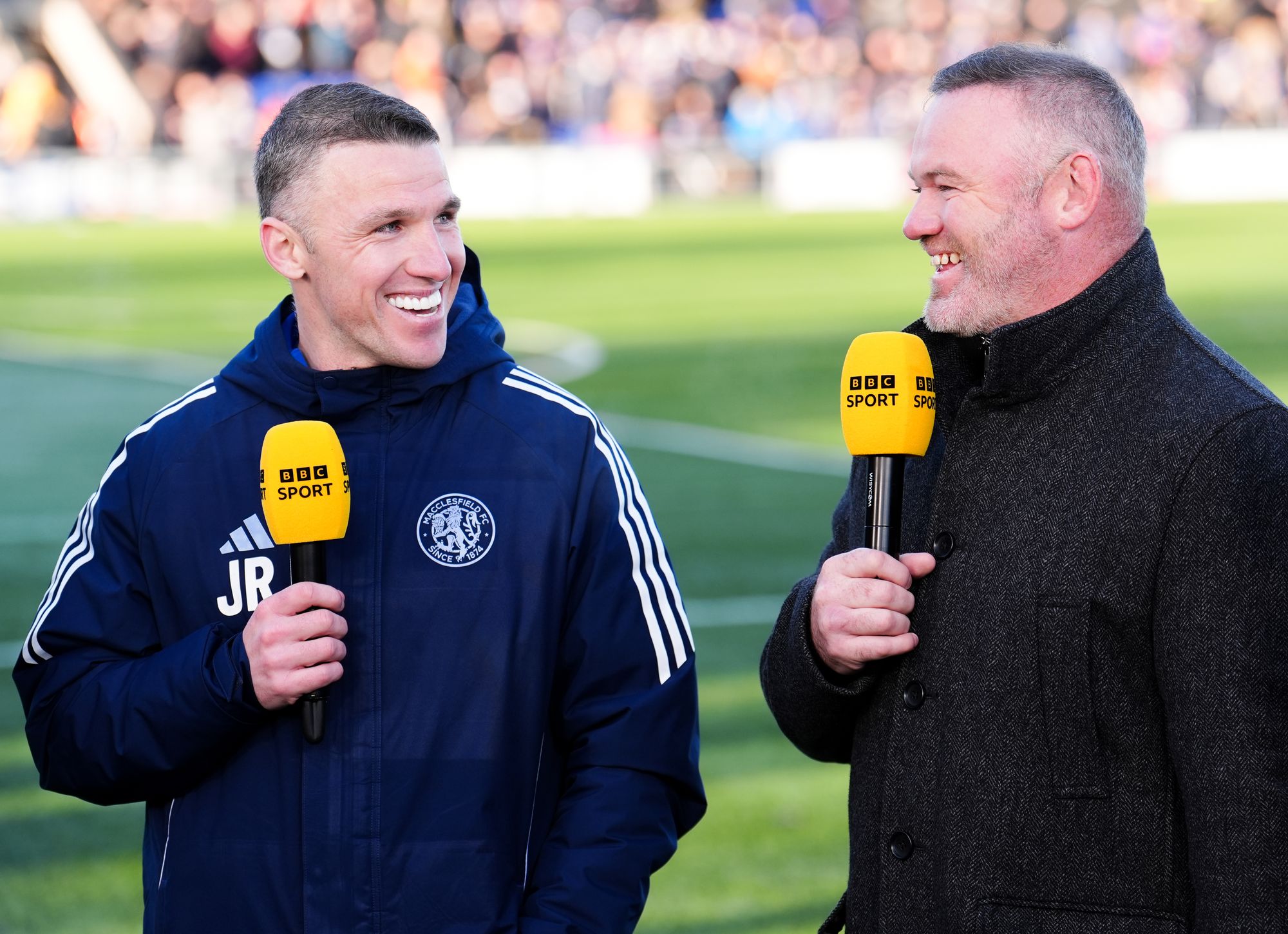 <p>John Rooney alongside brother Wayne at Moss Rose</p>