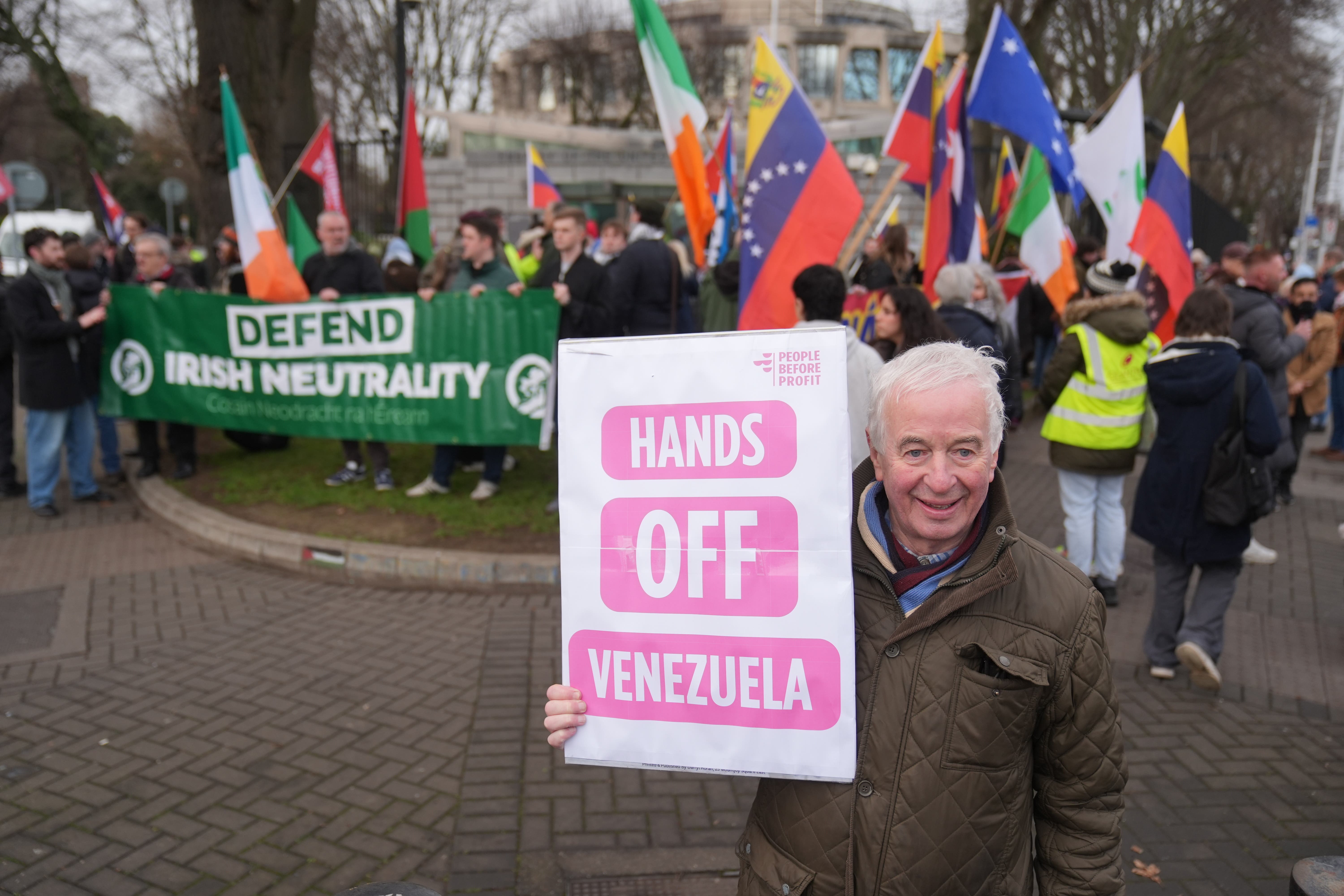 People attend a protest outside the US embassy in Dublin over the attack on Venezuela (Brian Lawless/PA)