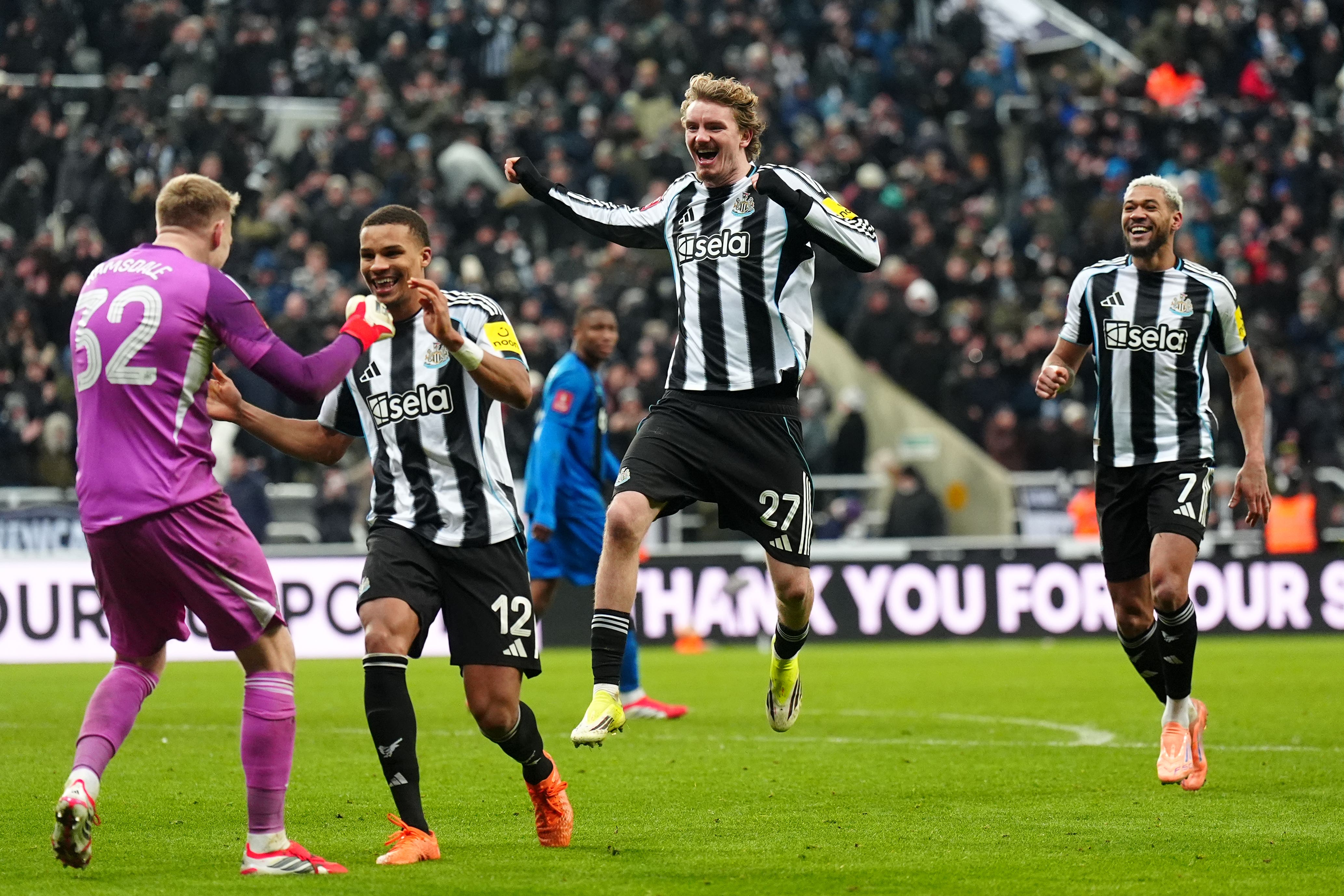 Newcastle’s players celebrate with goalkeeper Aaron Ramsdale, left (Owen Humphreys/PA)