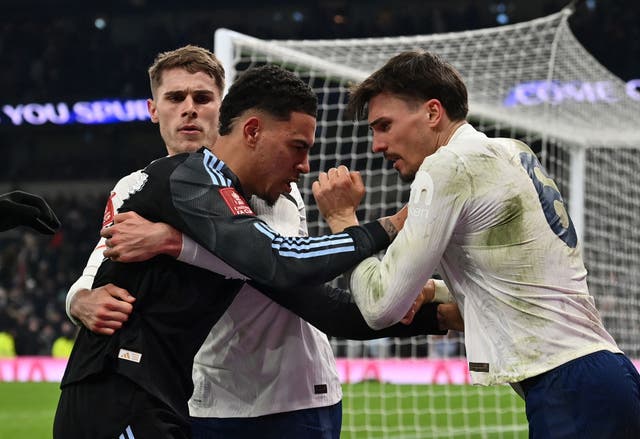 <p>Micky van de Ven holds back Aston Villa's Morgan Rogers as he remonstrates with Tottenham Hotspur's midfielder Joao Palhinha </p>