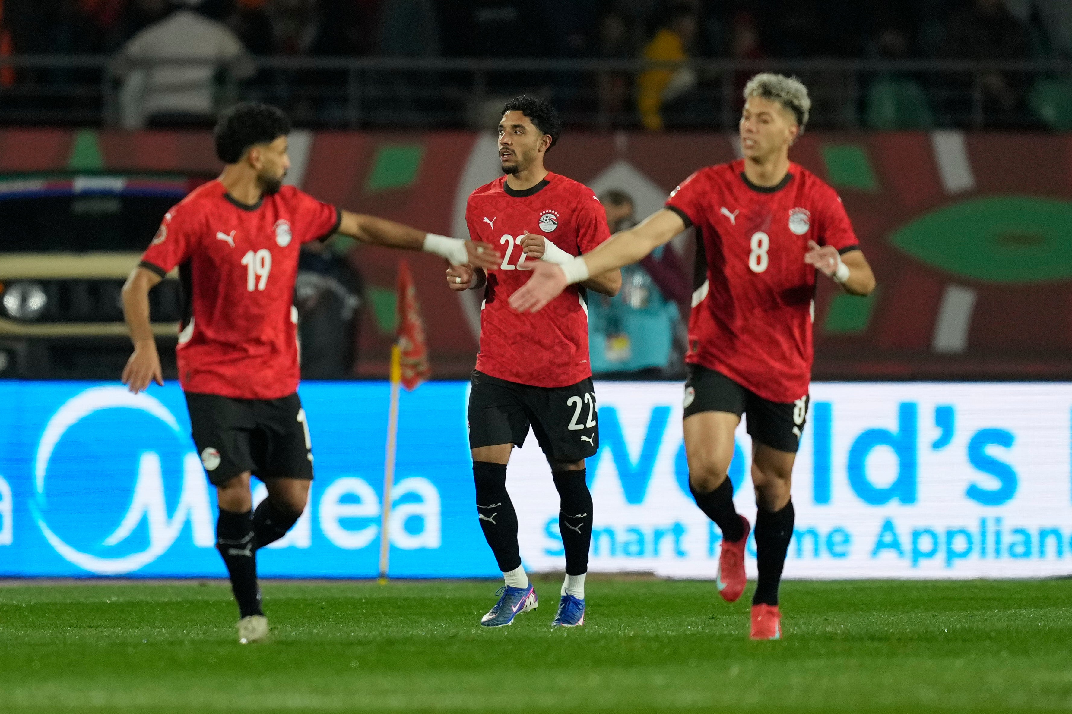 Egypt's Omar Marmoush, center, celebrates after scoring his side's opening goal