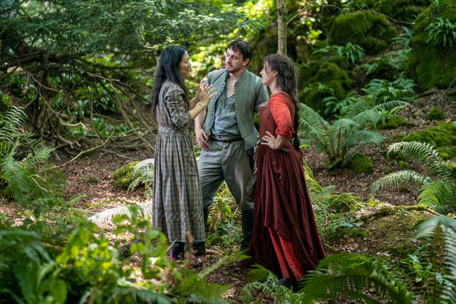 <p>Director Chloé Zhao with actors Paul Mescal and Jessie Buckley on the set of Hamnet</p>