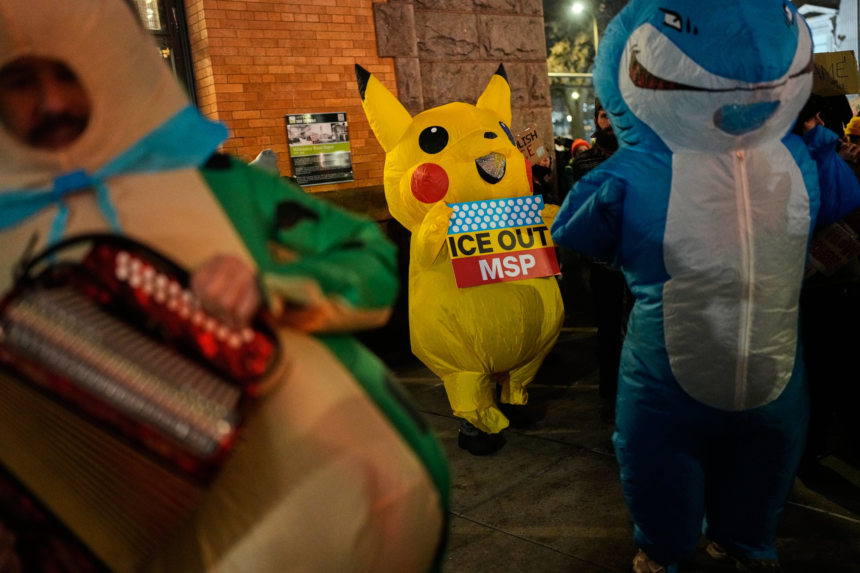 Protesters were spotted wearing costumes and waving signs at an anti-ICE protest in downtown Minneapolis on Friday night