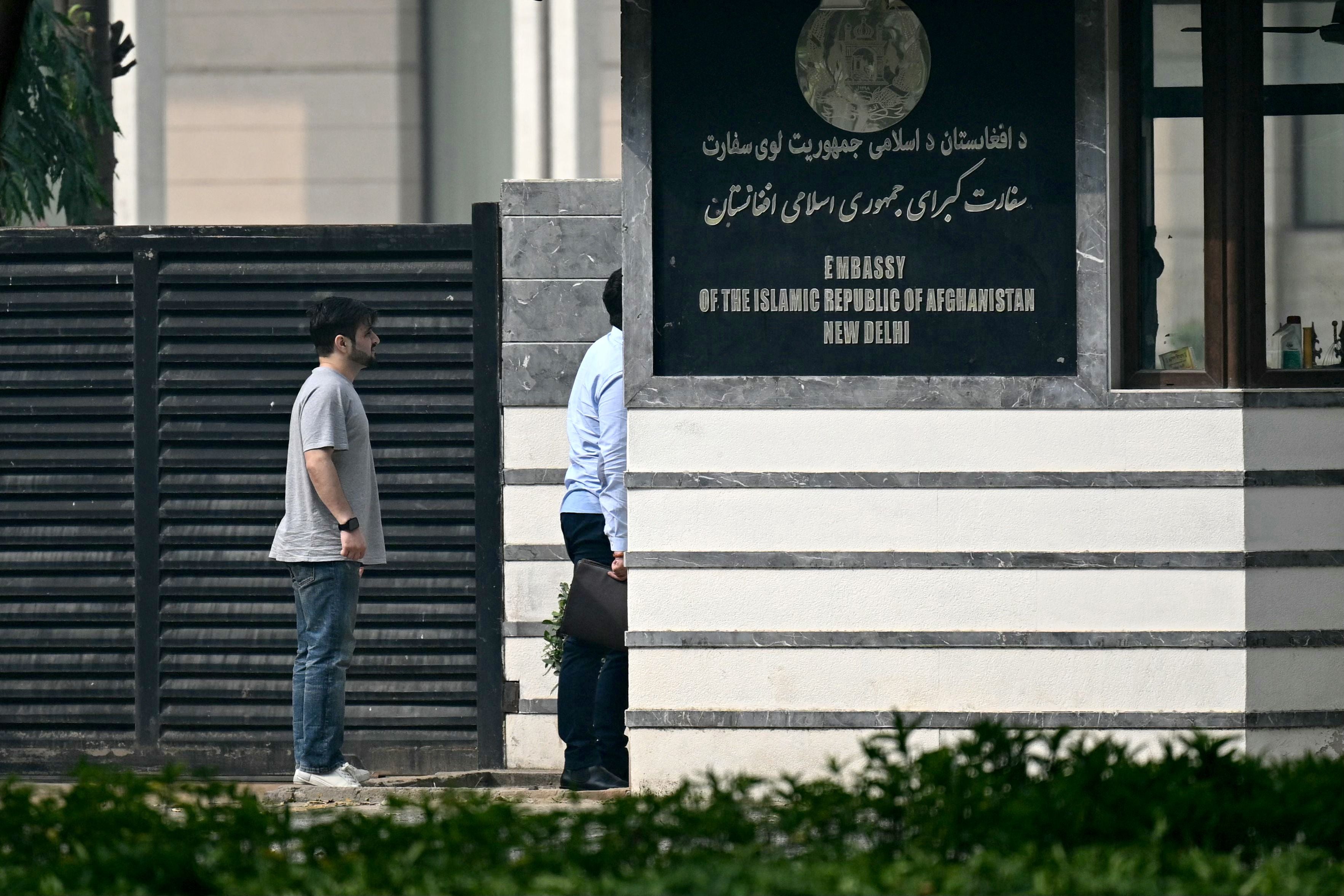 <p>File photo: Visitors stand outside the Afghanistan embassy in New Delhi in November 2023</p>