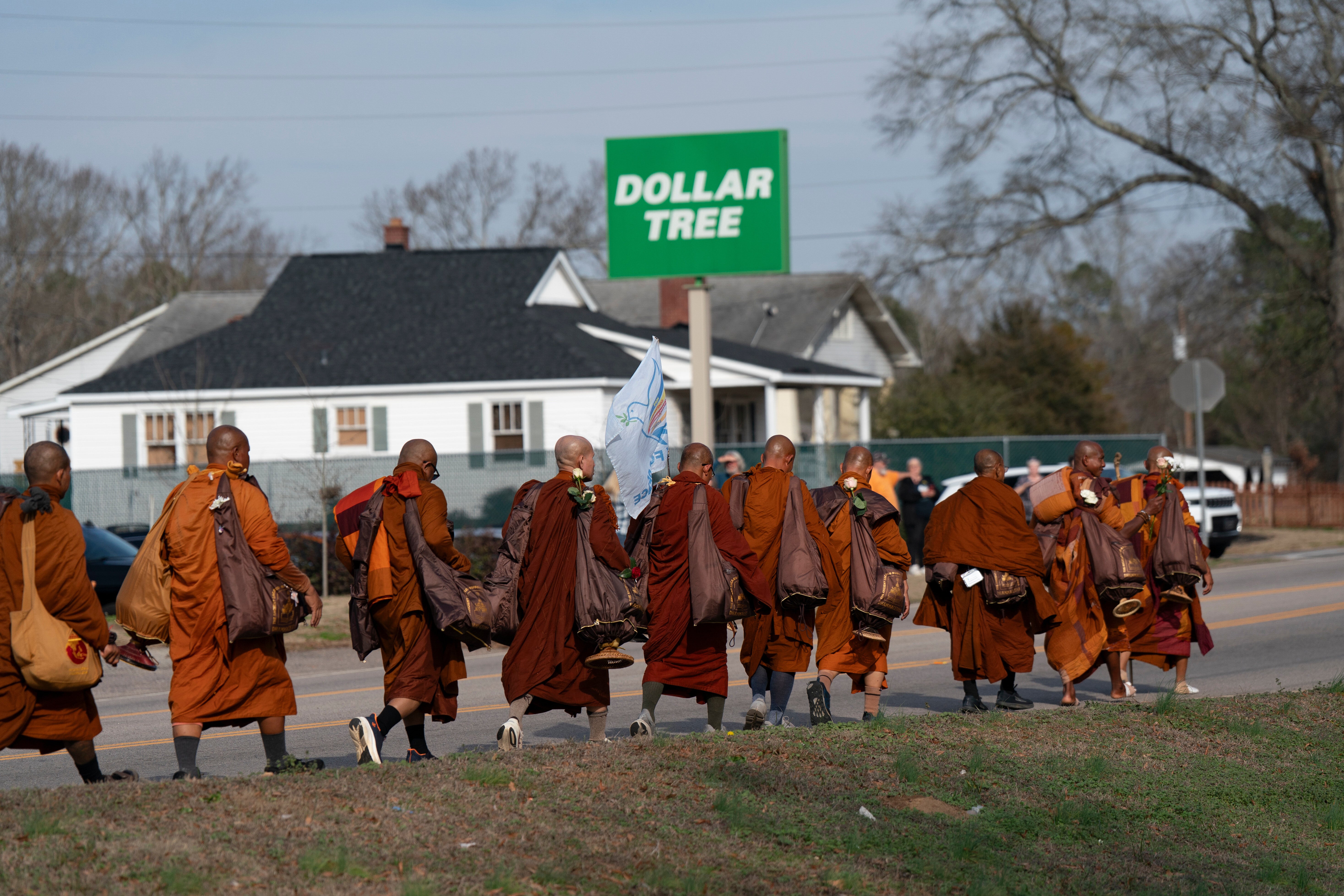 Buddhist monks participate in the, "Walk For Peace," Thursday, Jan. 8, 2026, in Saluda, S.C. (AP Photo/Allison Joyce)