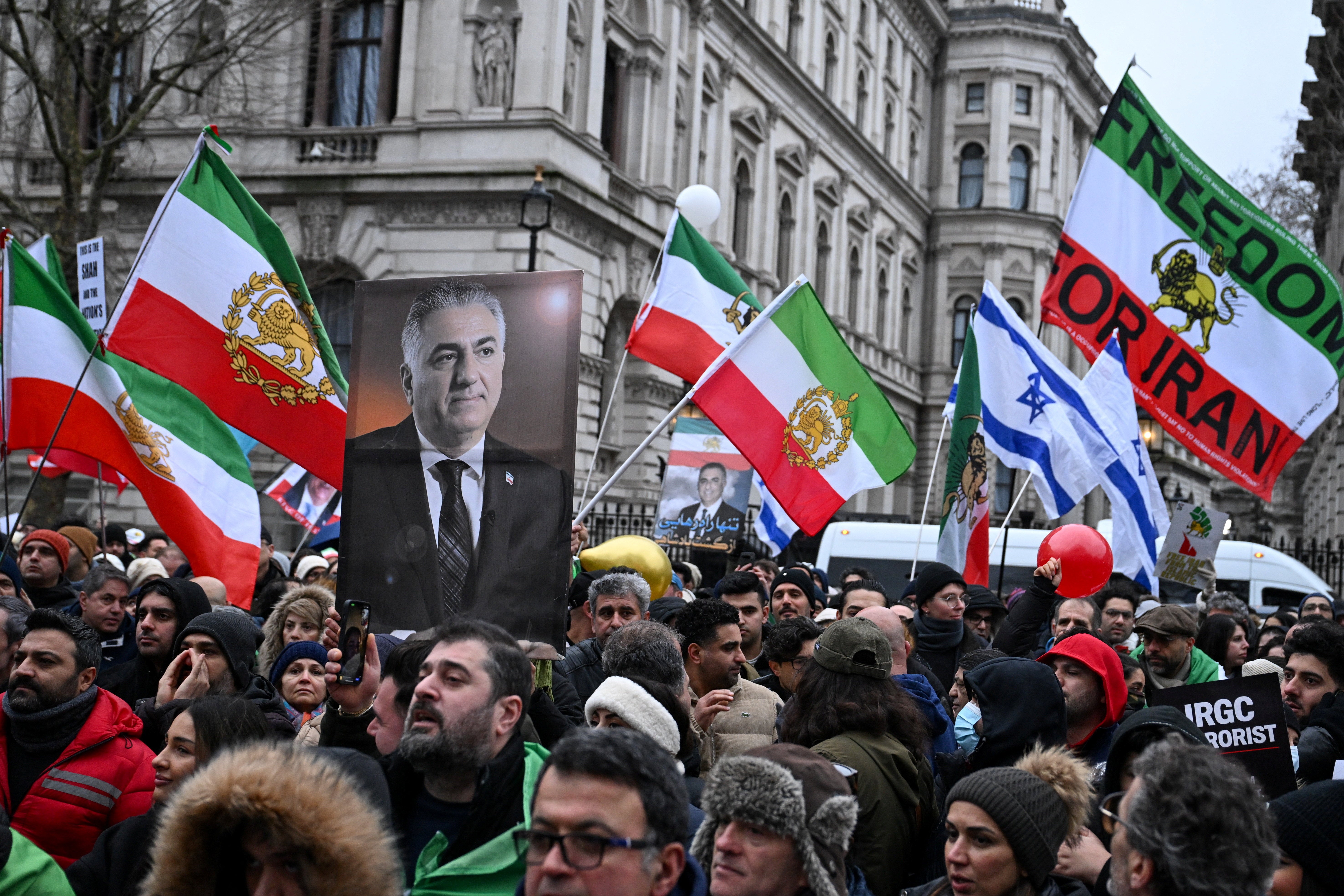 Supporters of Reza Pahlavi, the son of the deposed shah, rally in London