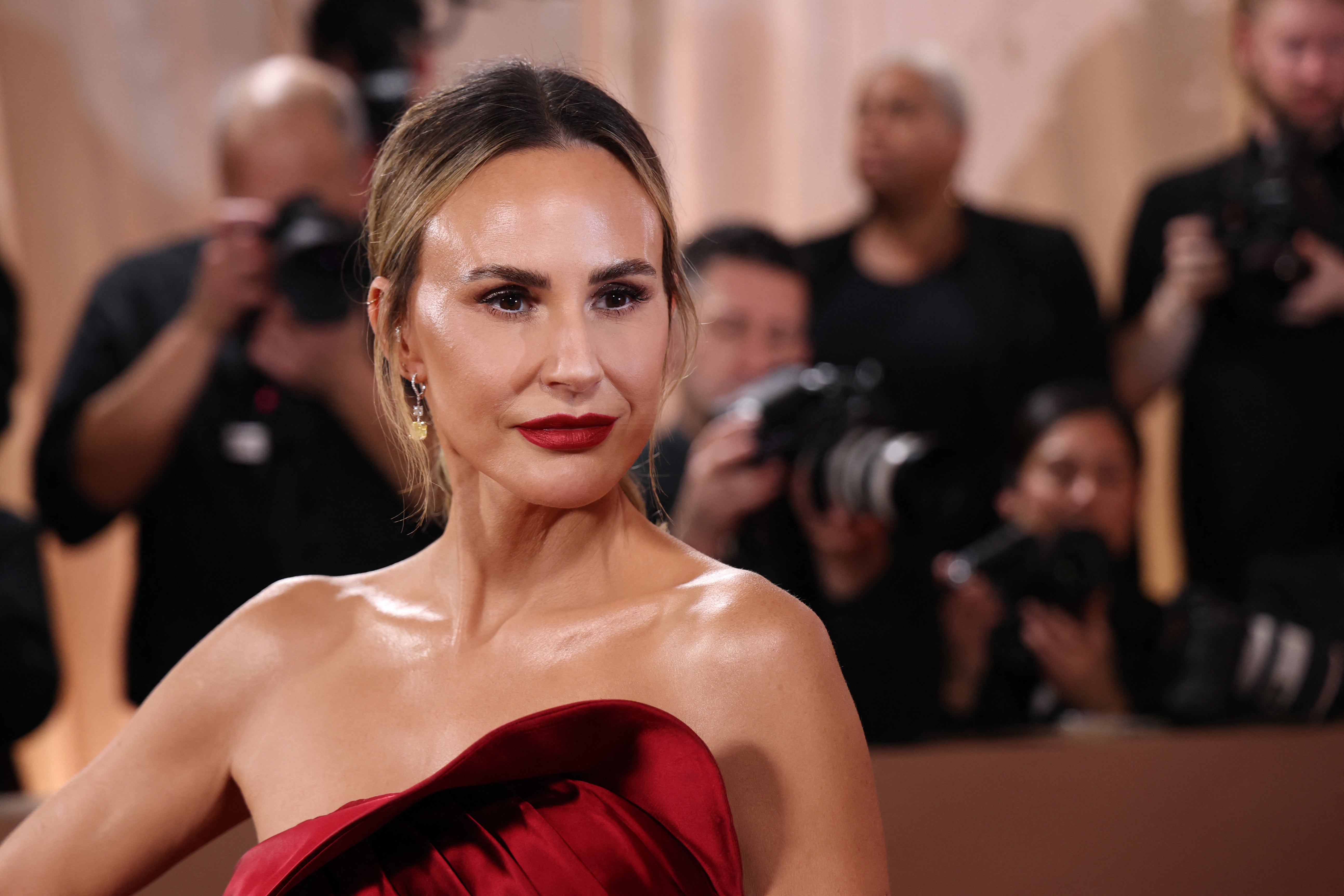 She paired the look with a classic red lipstick and gold earrings and had her hair in a low ponytail