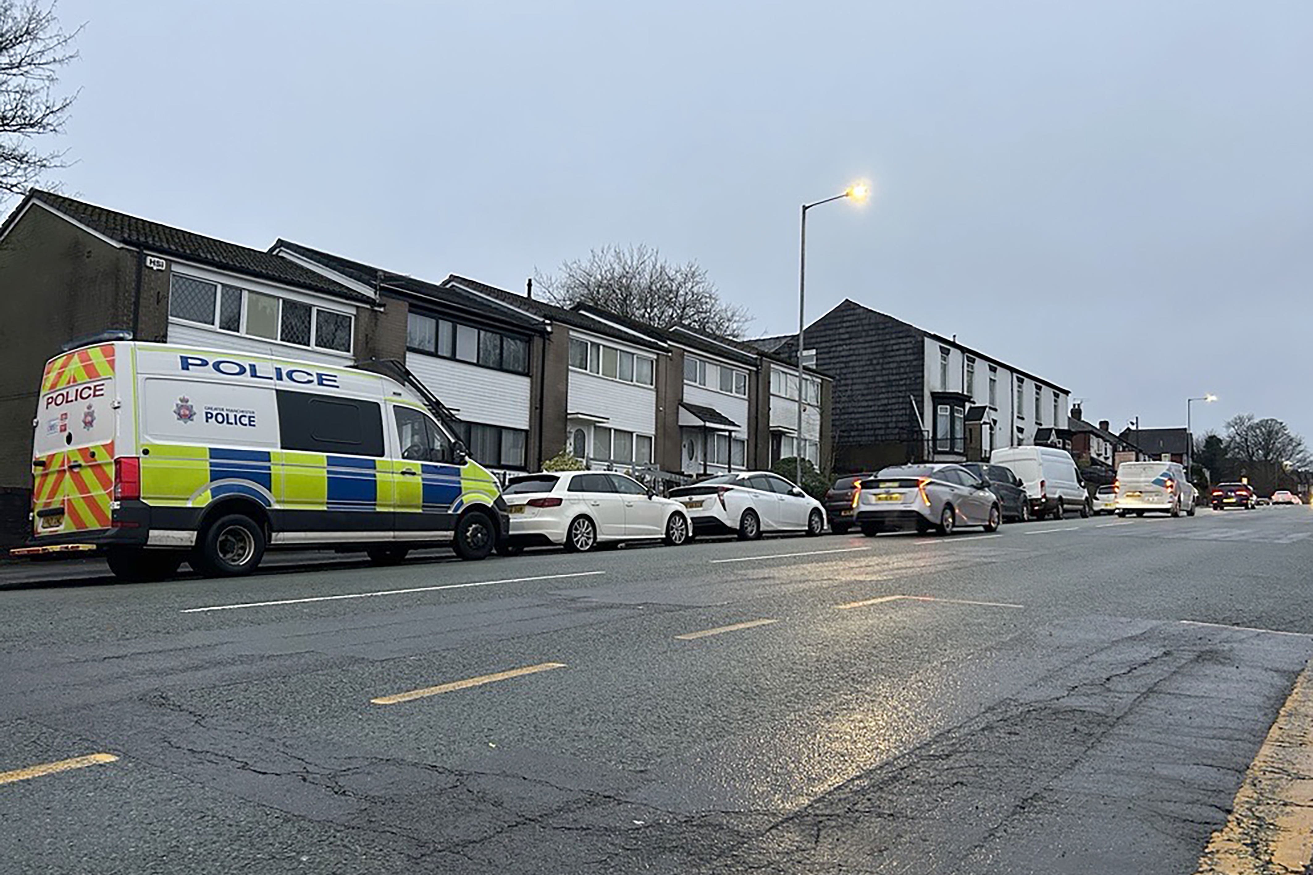 Police near the scene where a Seat Leon collided with a Citroen C4 Picasso taxi on Wigan Road in Bolton (Madhuri Karia/PA)