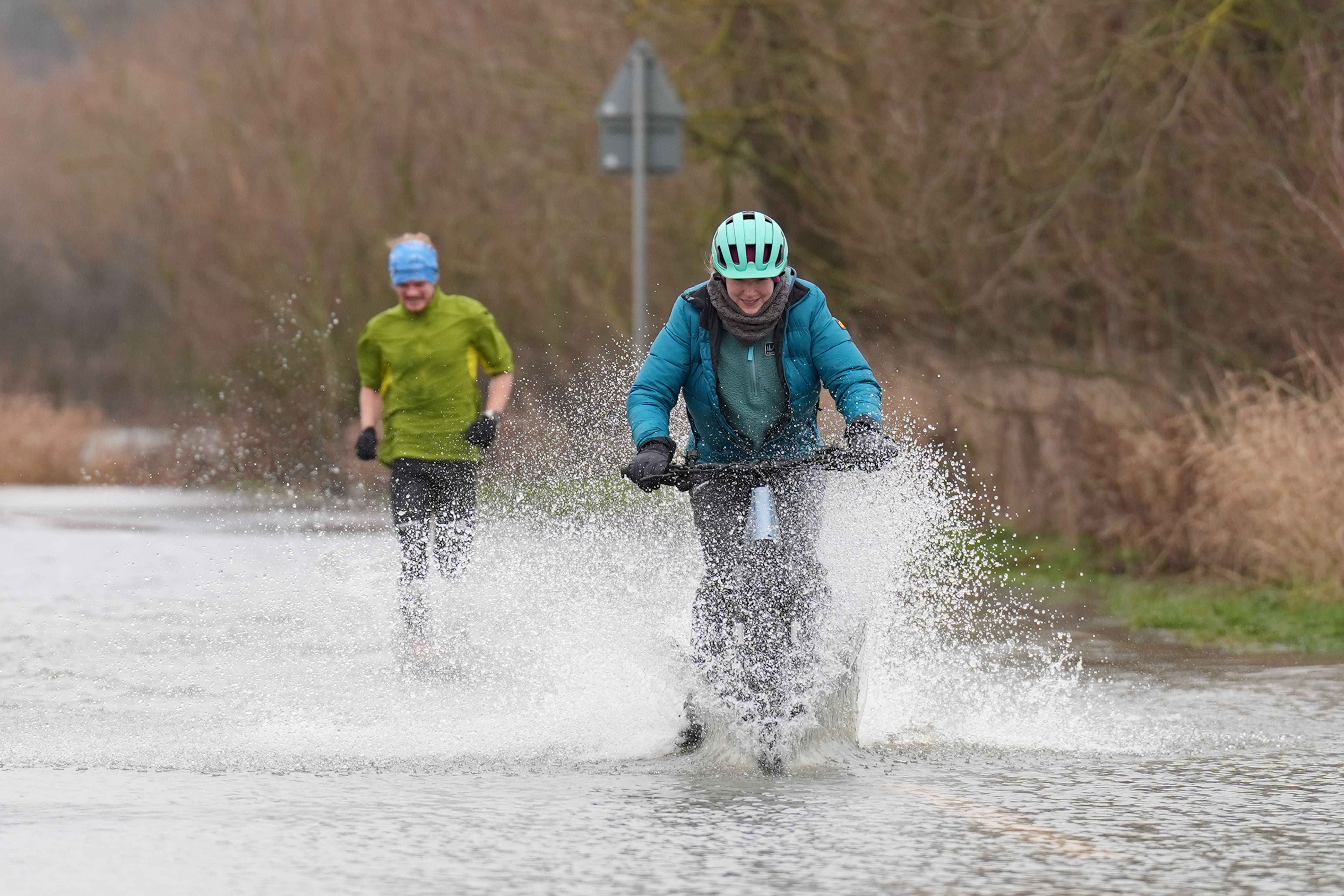Melting snow and ice along with heavy rain may cause flooding, the Met Office said (Joe Giddens/PA)