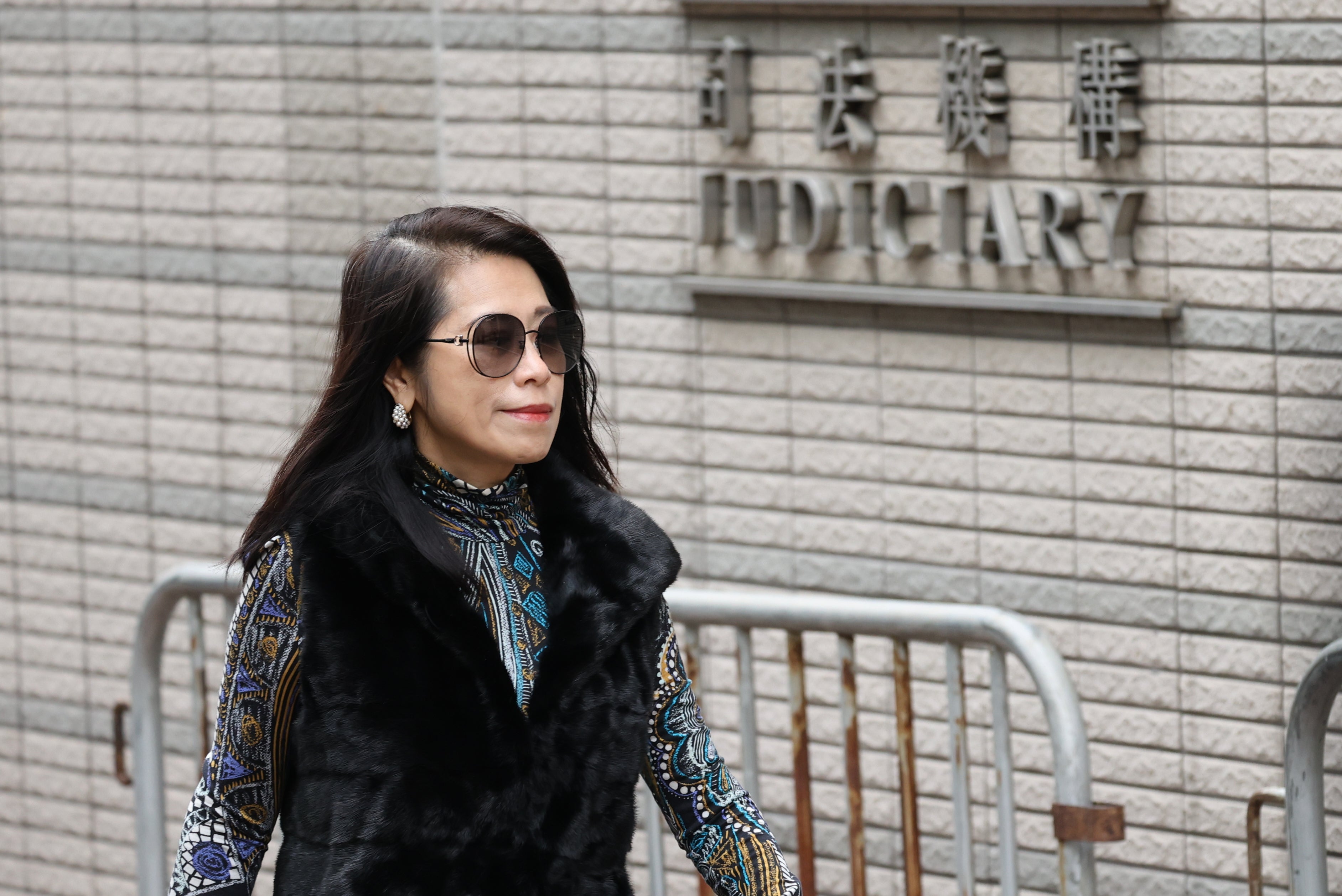 Teresa Lai, wife of pro-democracy media mogul Jimmy Lai arrives at the West Kowloon Magistrates’ Courts in Hong Kong on 12 January to attend a hearing to hear arguments about the sentencing of her husband