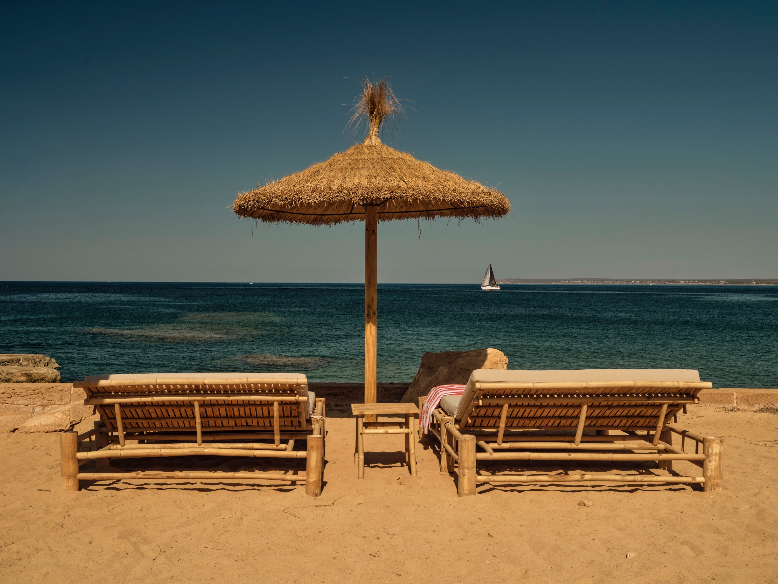 There are loungers around the pool or, if you’d prefer, on the rocks looking out to sea