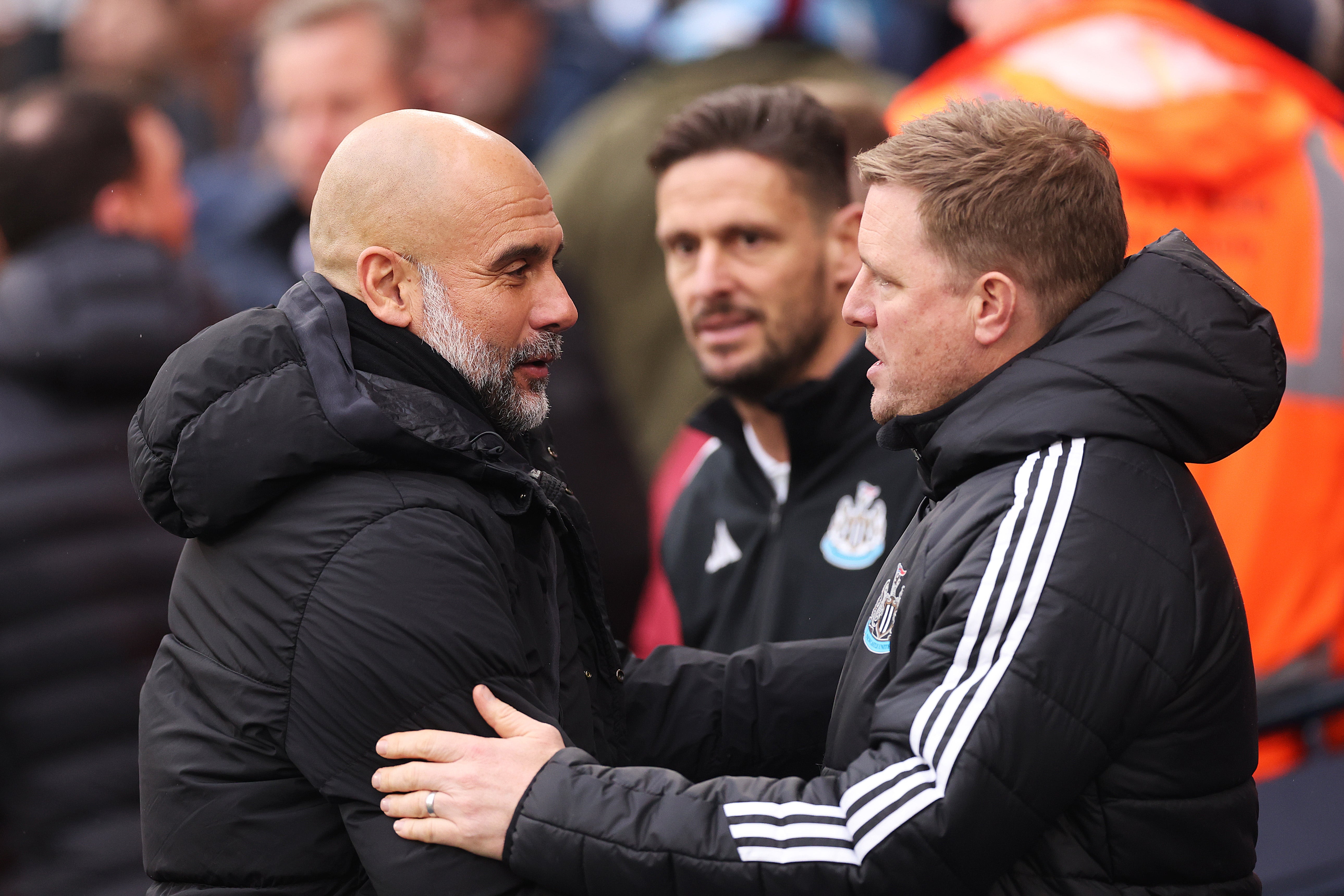 <p>Pep Guardiola and Eddie Howe embrace before their meeting in February</p>