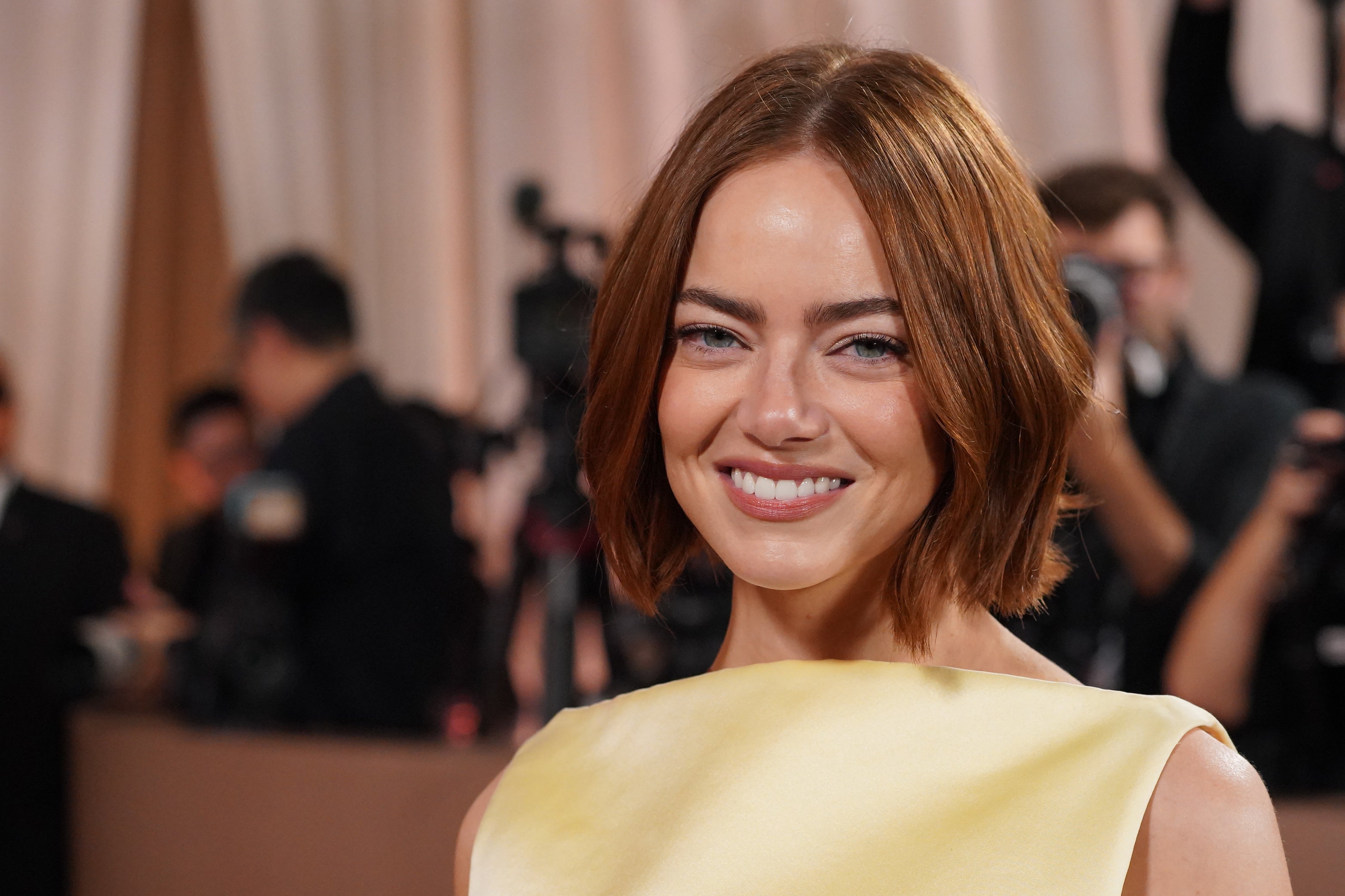 Emma Stone put down her white wine and took her friend’s face in her hands