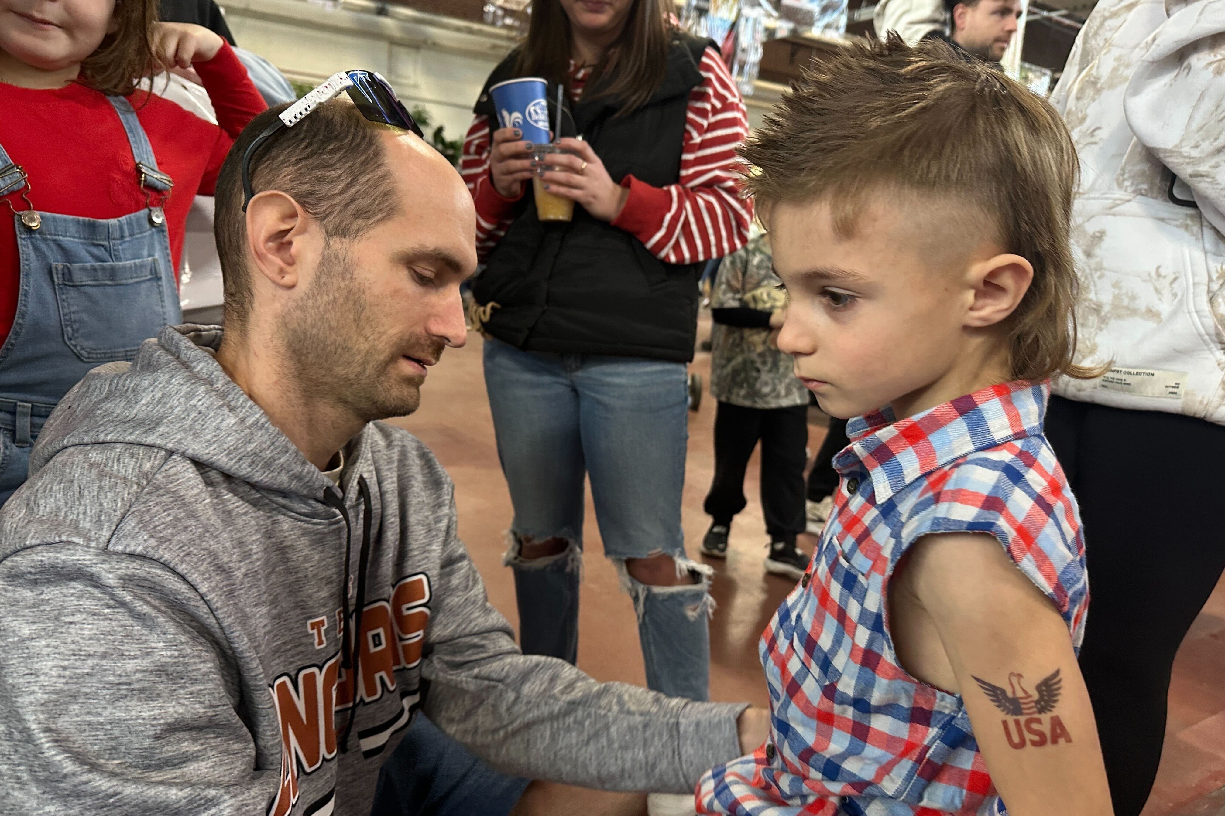 Billy Jenkins gets his 6-year-old son Axell Jenkins ready for a mullet hairstyle contest