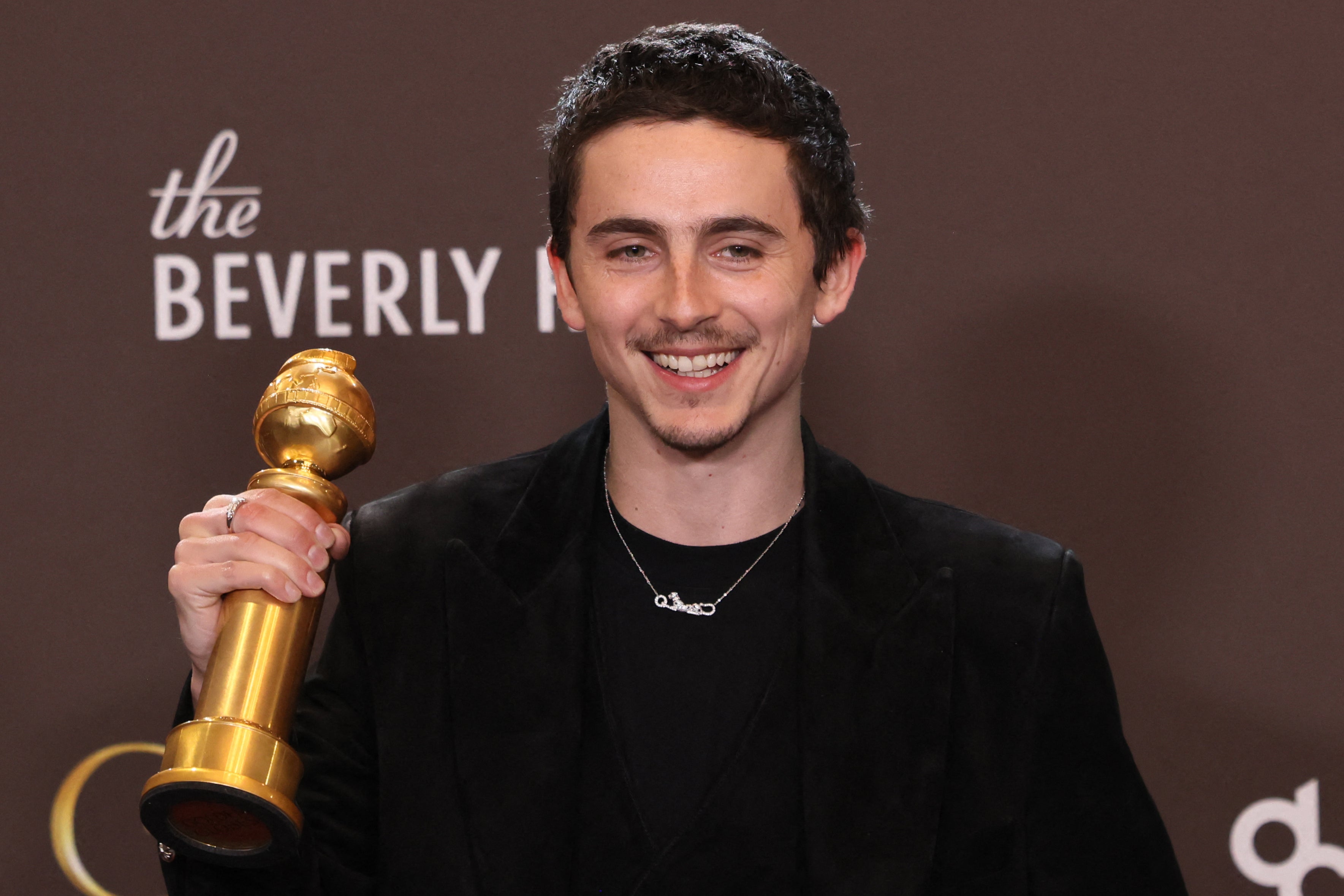 <p>Timothee Chalamet with the Golden Globe for Best Actor in a Motion Picture Musical or Comedy for 'Marty Supreme'</p>