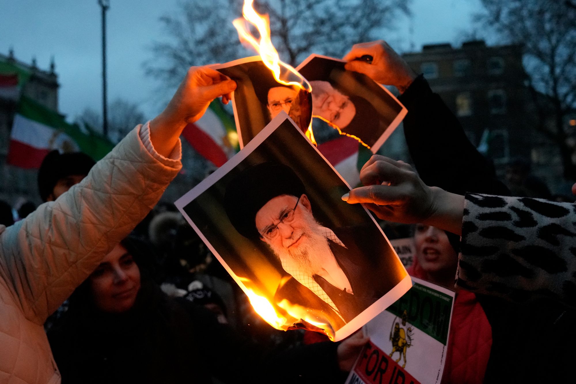 Protestors burn images of Ayatollah Ali Khamenei during a rally held in Solidarity with Iran's Uprising, organised by The national Council of Resistance of Iran, on Whitehall in central London on 11 January 2026