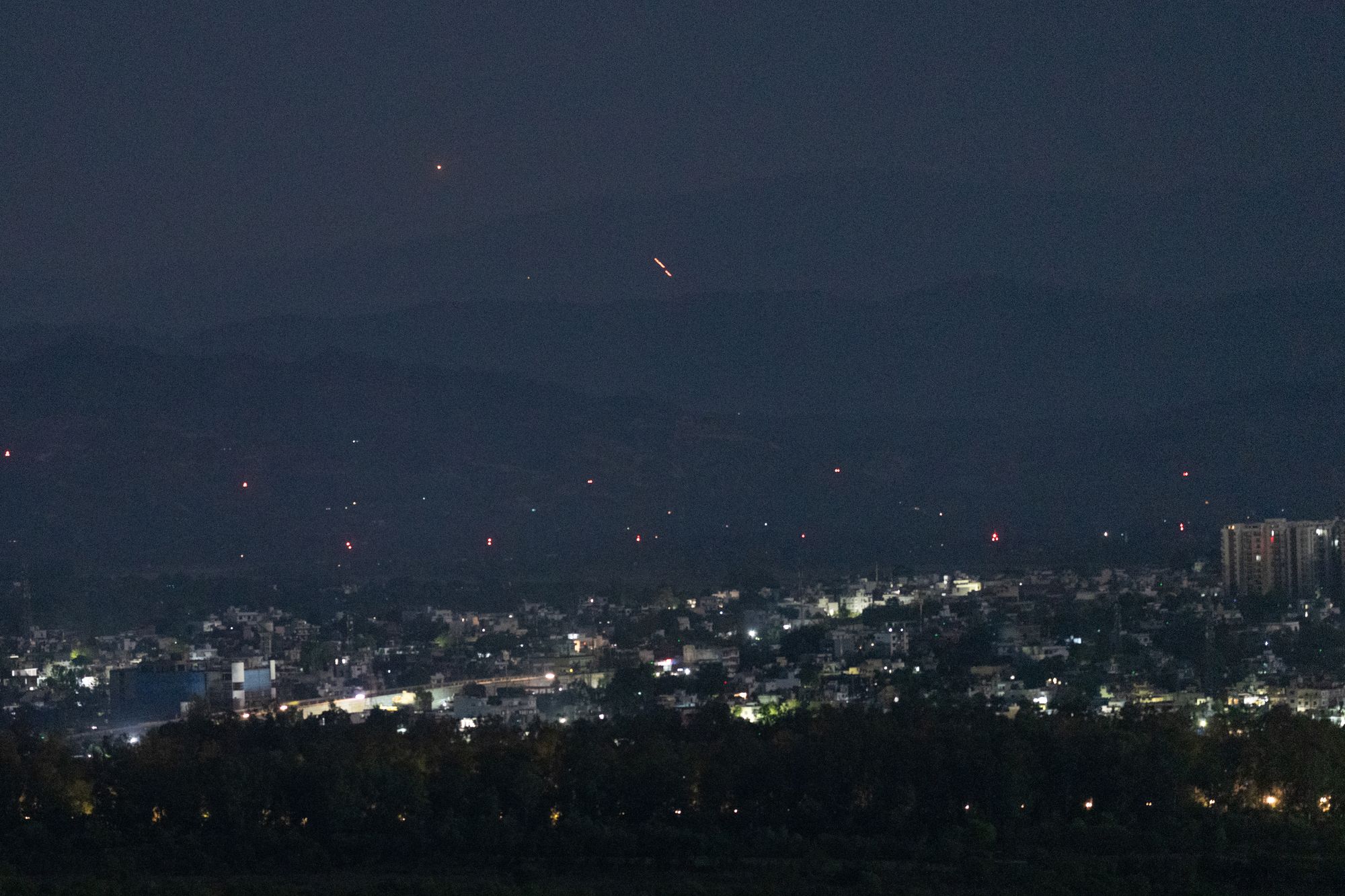 <p>File. Streaks of light illuminate the sky as Indian air defence systems engage suspected Pakistani drones in Jammu on 10 May 2025</p>