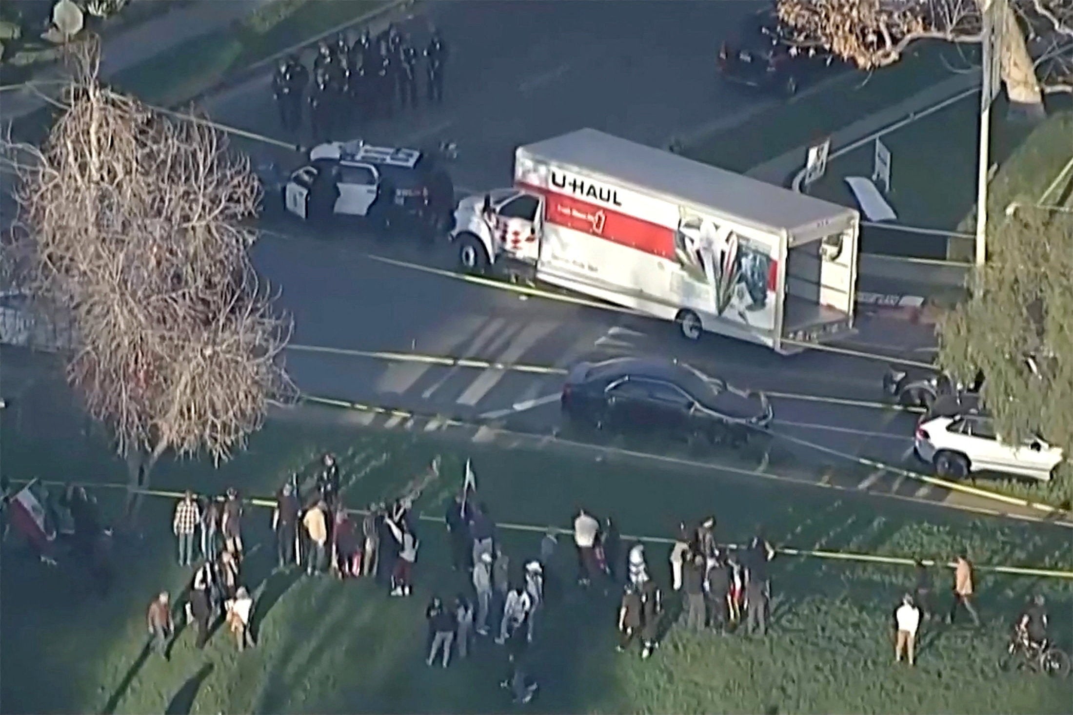 A man has been ‘detained pending further investigation’ after driving a U-Haul truck towards a group of protesters, police say