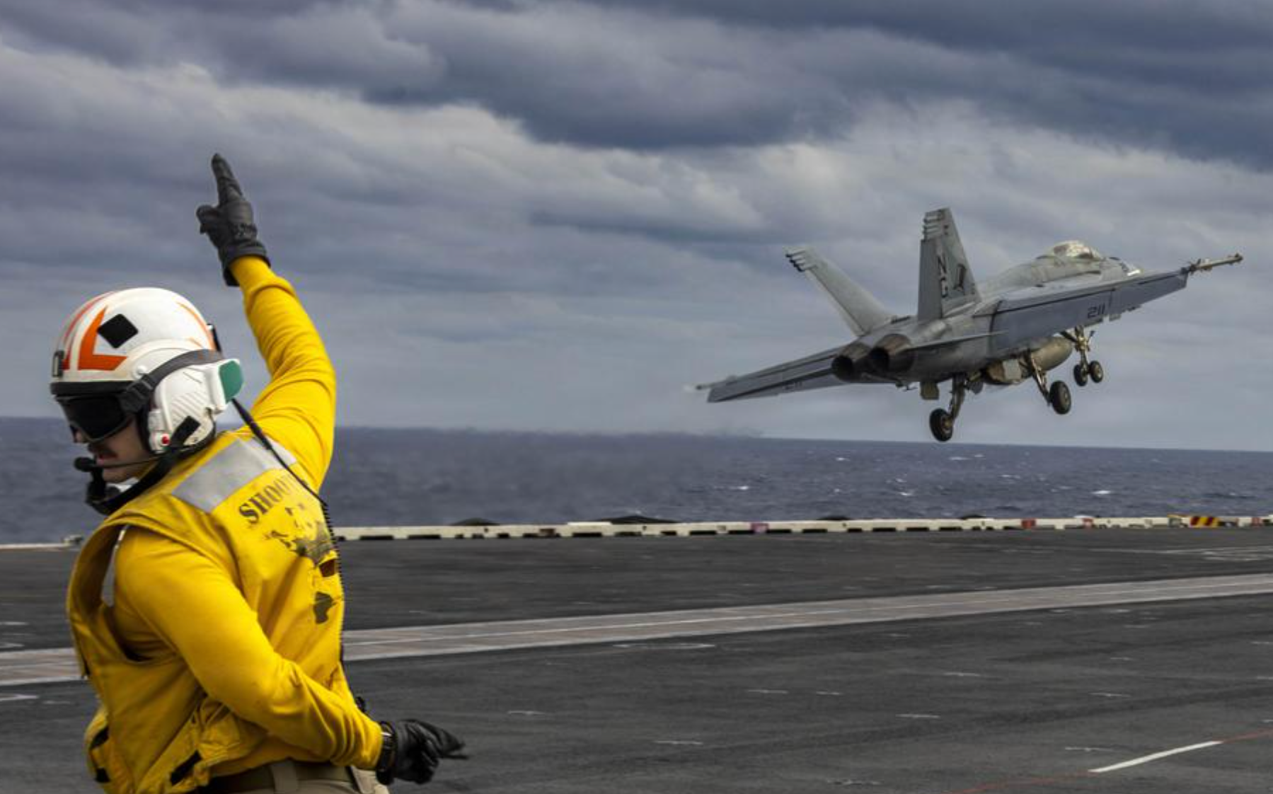 An F/A-18E Super Hornet with Strike Fighter Squadron 14 launches from the aircraft carrier USS Abraham Lincoln in the South China Sea on January 4 2026