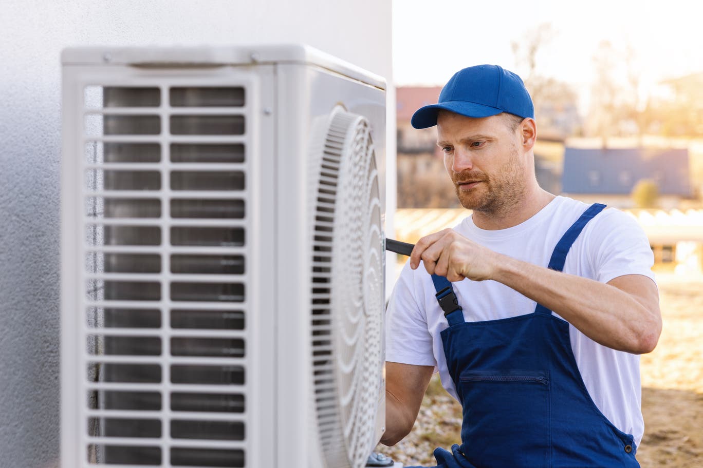 A man fixing an air conditioner 