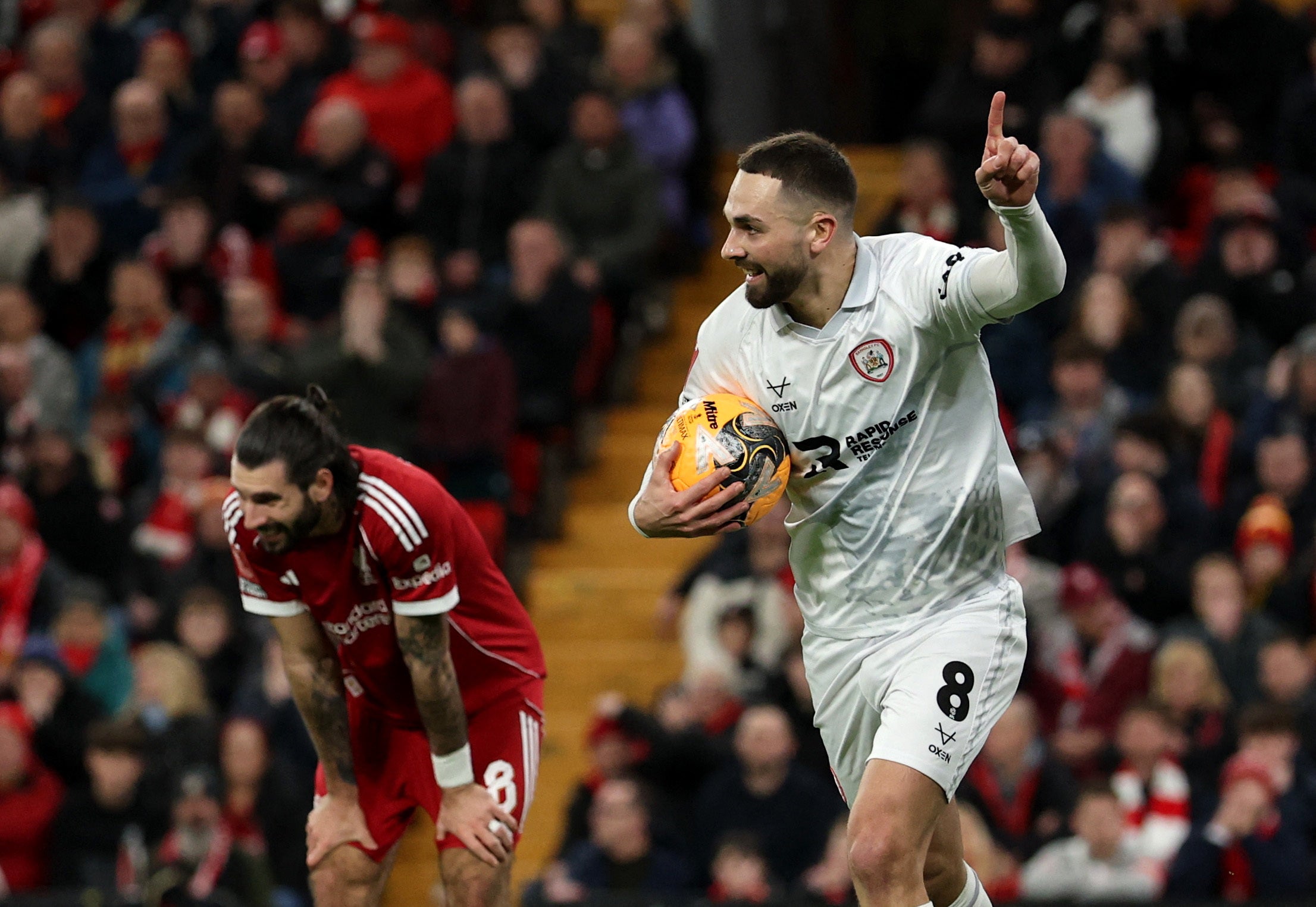 Adam Phillips wheels away in celebration after pouncing on Dominik Szoboszlai’s error to score for Barnsley
