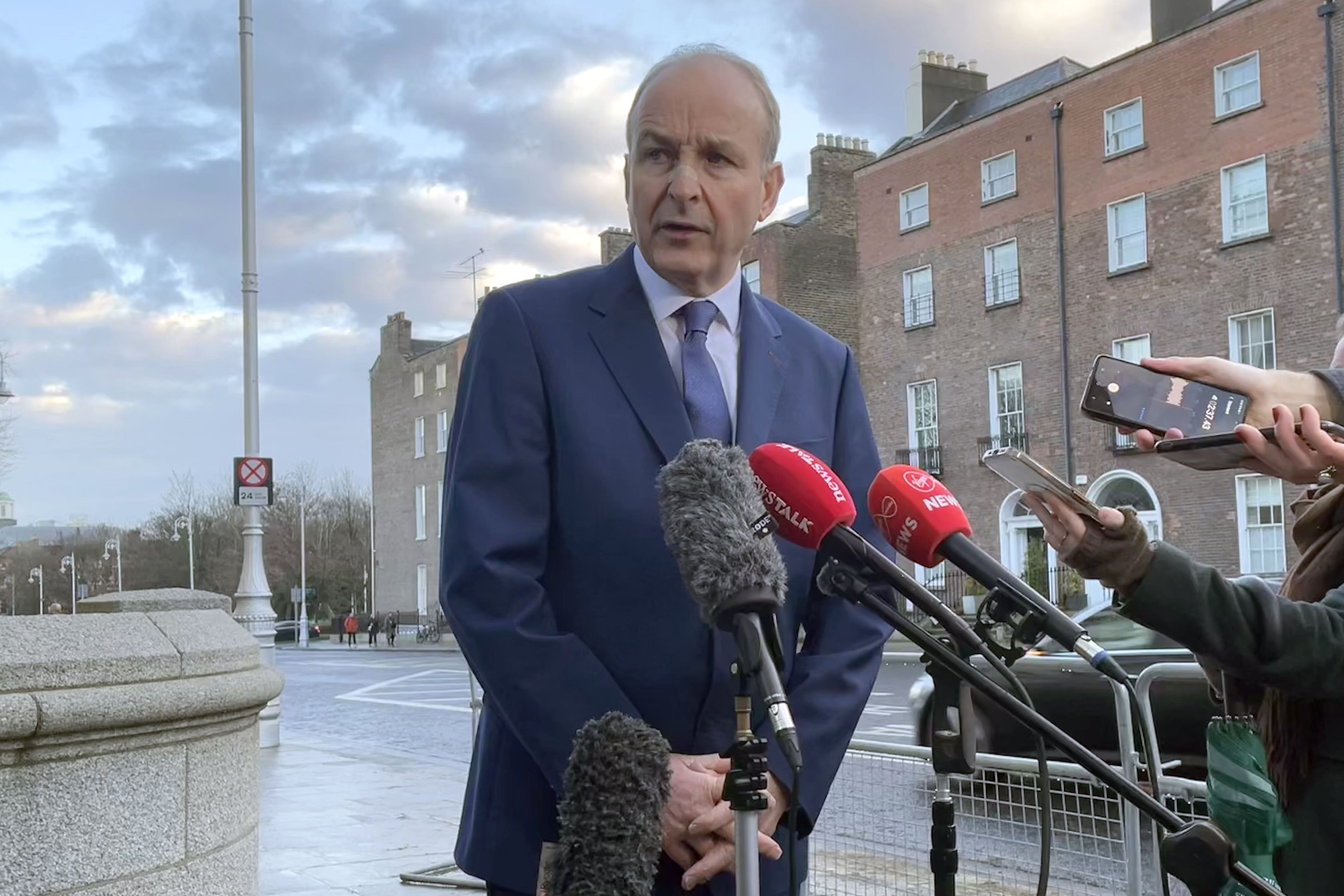 Taoiseach Micheal Martin speaking to members of the media outside Government Buildings in Dublin (Grainne Ni Aodha/PA)