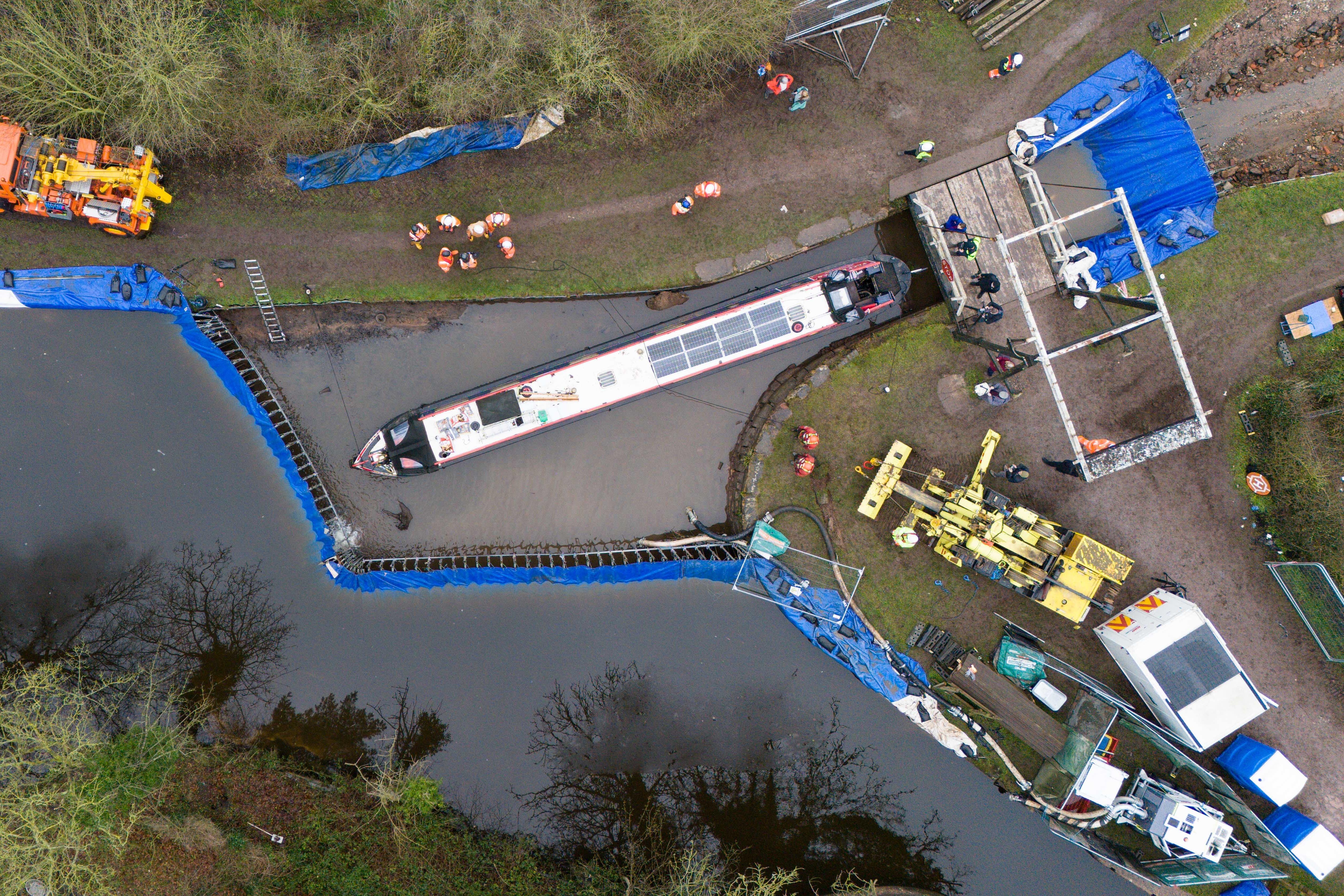 Waterways engineers working alongside the Canal and River Trust refill an area of canal containing the Pacemaker boat, as they begin repairs to a large “sinkhole” which breached a canal in the Chemistry area of Whitchurch, Shropshire in December. Picture date: Tuesday January 13, 2026.