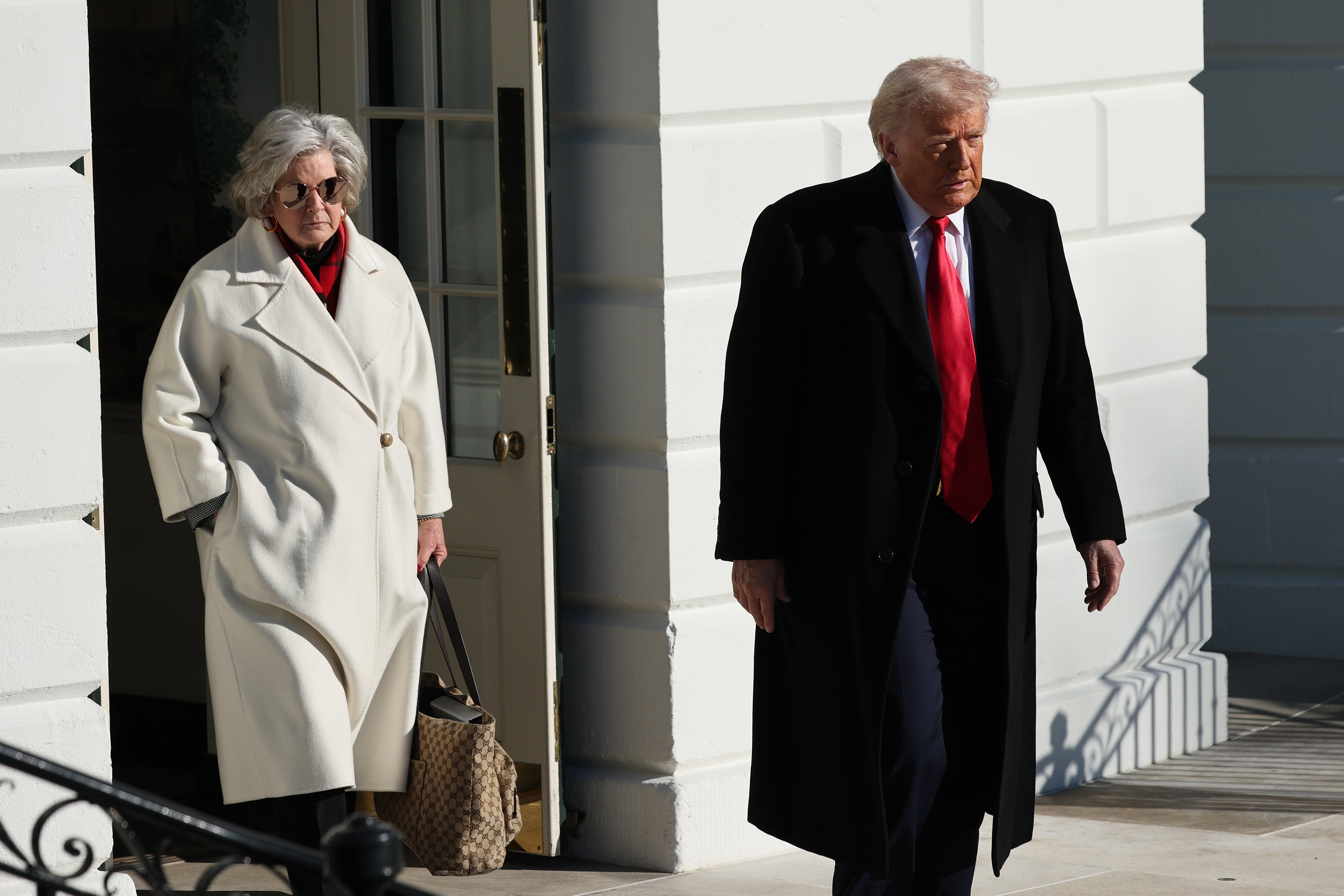 White House Chief of Staff Susie Wiles and President Donald Trump leave the White House as they depart for their day trip to Michigan