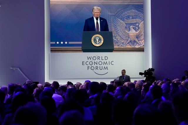 <p>Attendees listen to a virtual speech by US president Donald Trump at the annual meeting of the World Economic Forum in Davos, Switzerland, in 2025</p>
