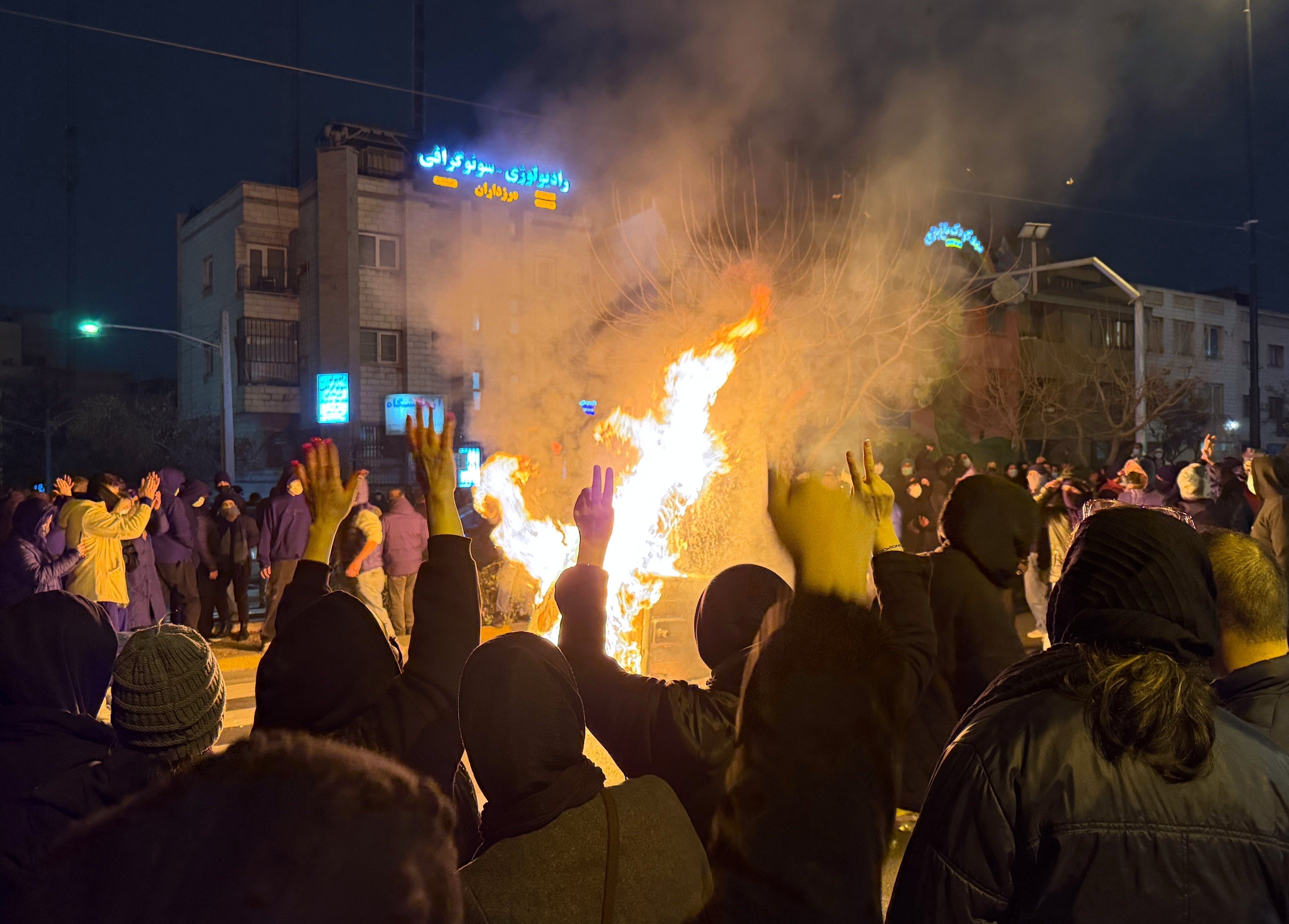 In this photo obtained by The Associated Press, Iranians attend an anti-government protest in Tehran, Iran, Friday, Jan. 9, 2026